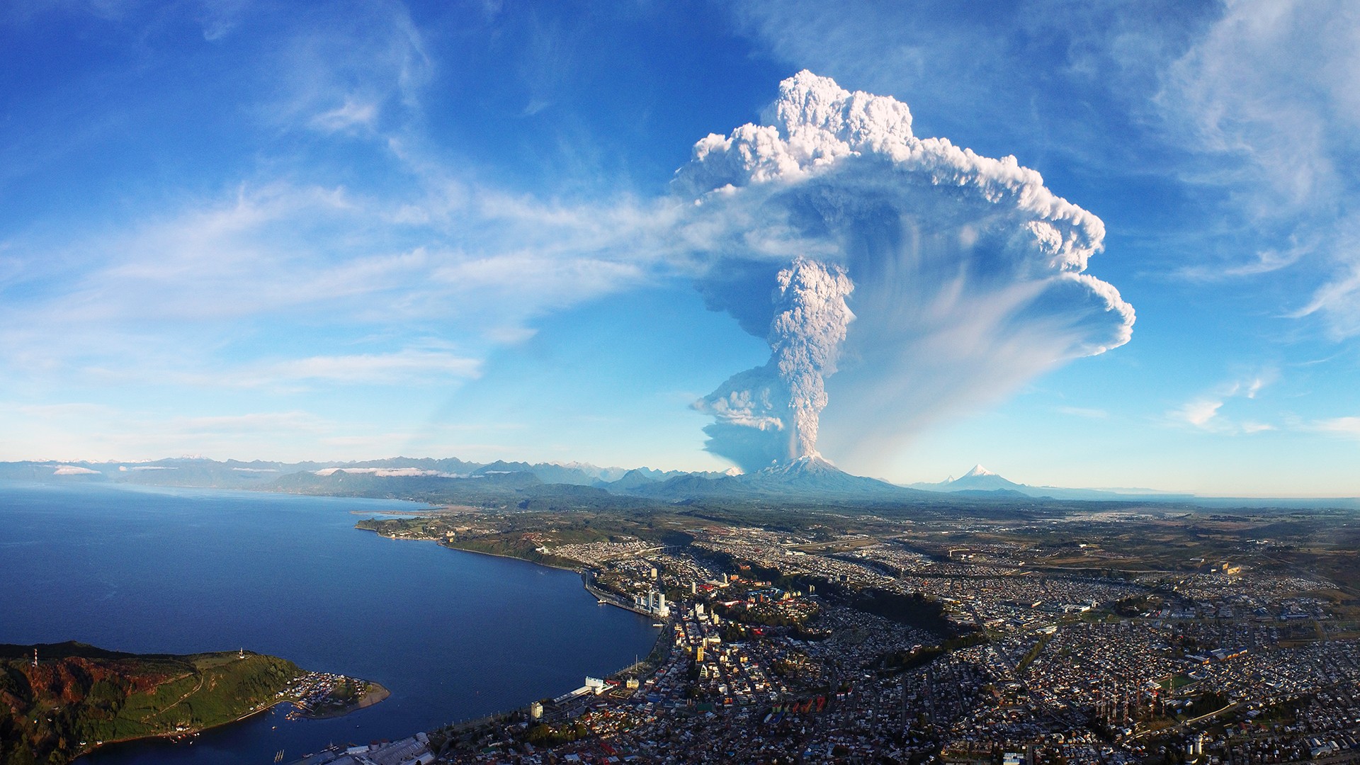 Chile Volcano Cityscape City Building Nature Eruption Smoke Mountains Snowy Peak Water Sea Hills Hou 1920x1080