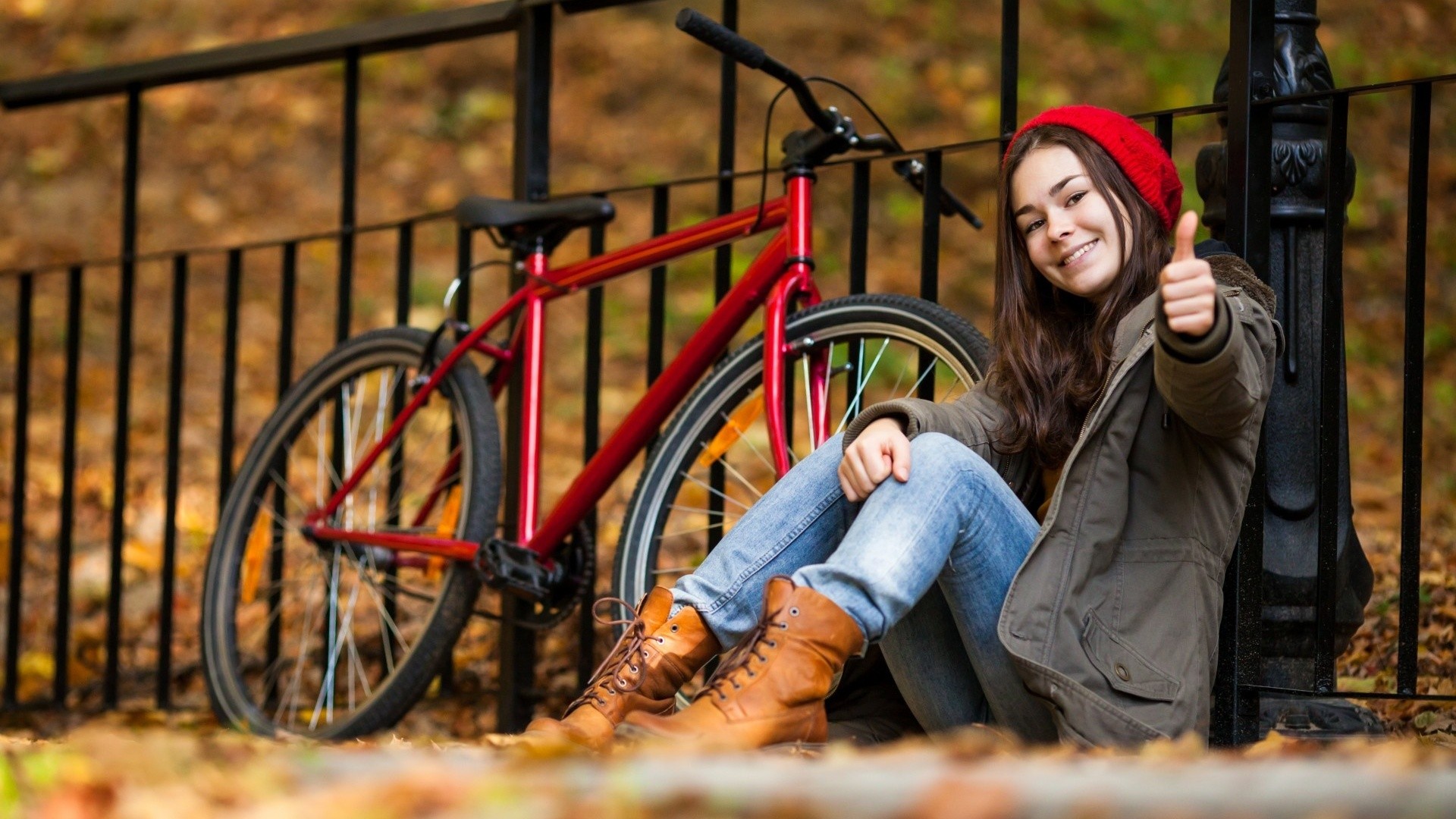 Women Model Brunette Long Hair Women Outdoors Sitting Smiling Jeans Boots Bicycle Fence Fall Leaves  1920x1080
