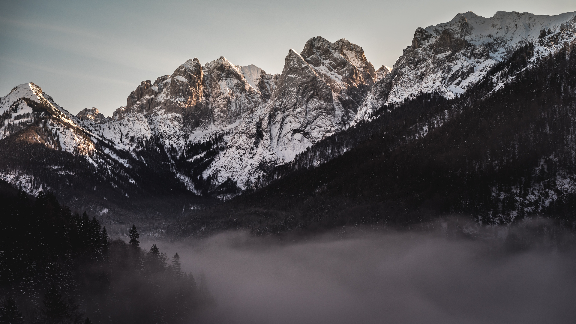 Nature Landscape Trees Forest Dark Mist Mountains Snowy Mountain Clouds Sky Sunlight Tyrol Austria 1920x1080