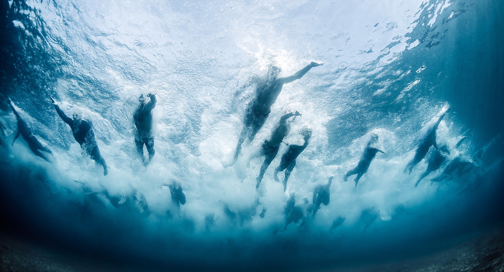 People Swimming Underwater 1999x1080