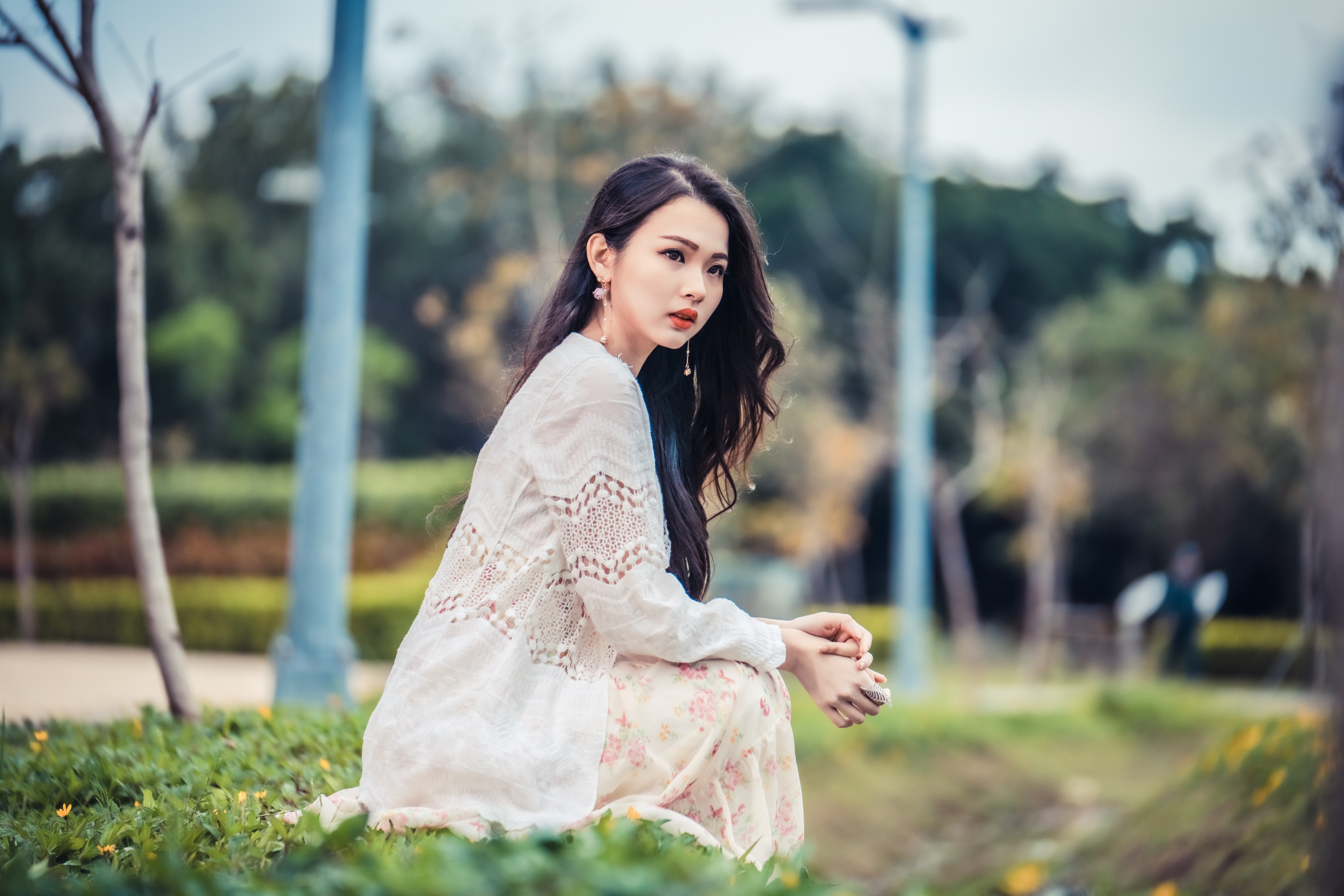 Asian Model Women Sitting White Dress Grass Flowers Trees Poles Earring Long Hair Brunette 3840x2561