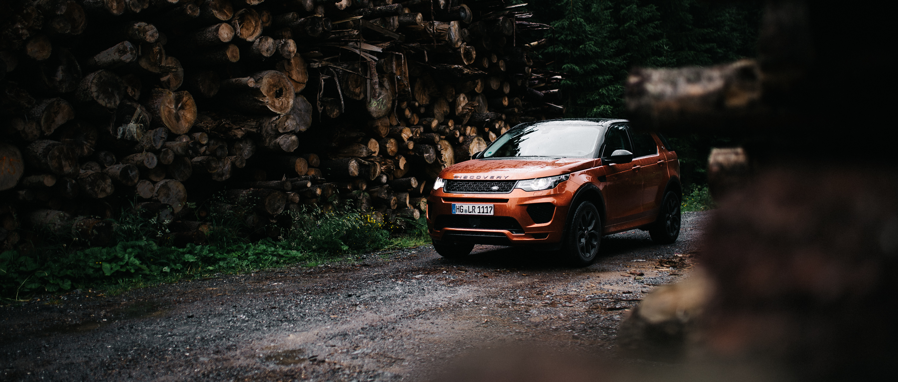Vehicle Land Rover Car Landscape Forest Tree Bark Rain Road Trees Front Angle View 3000x1277