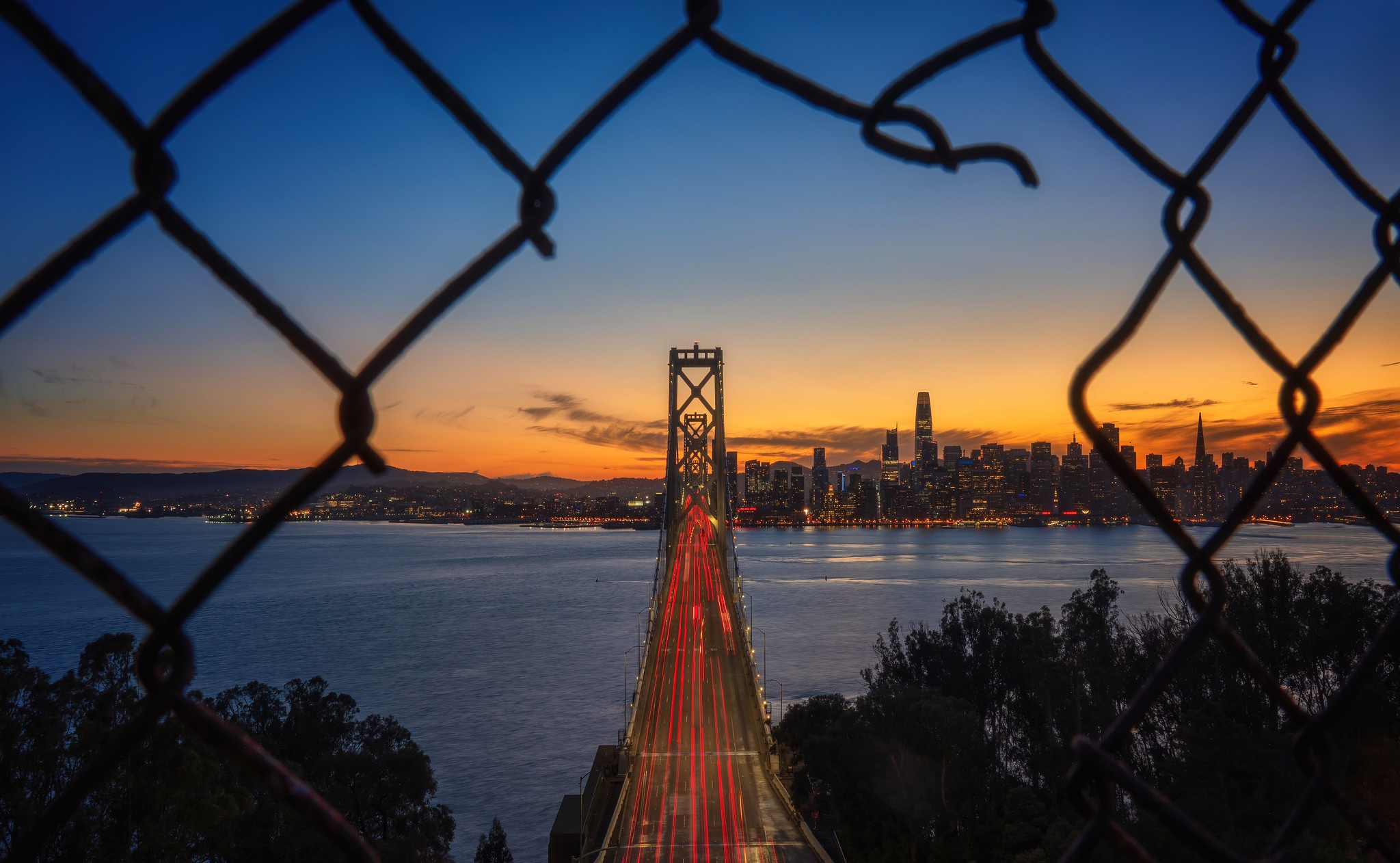 San Francisco California USA Oakland Bay Bridge Skyscraper Building Sunset Evening Lights Sky Clouds 2048x1262