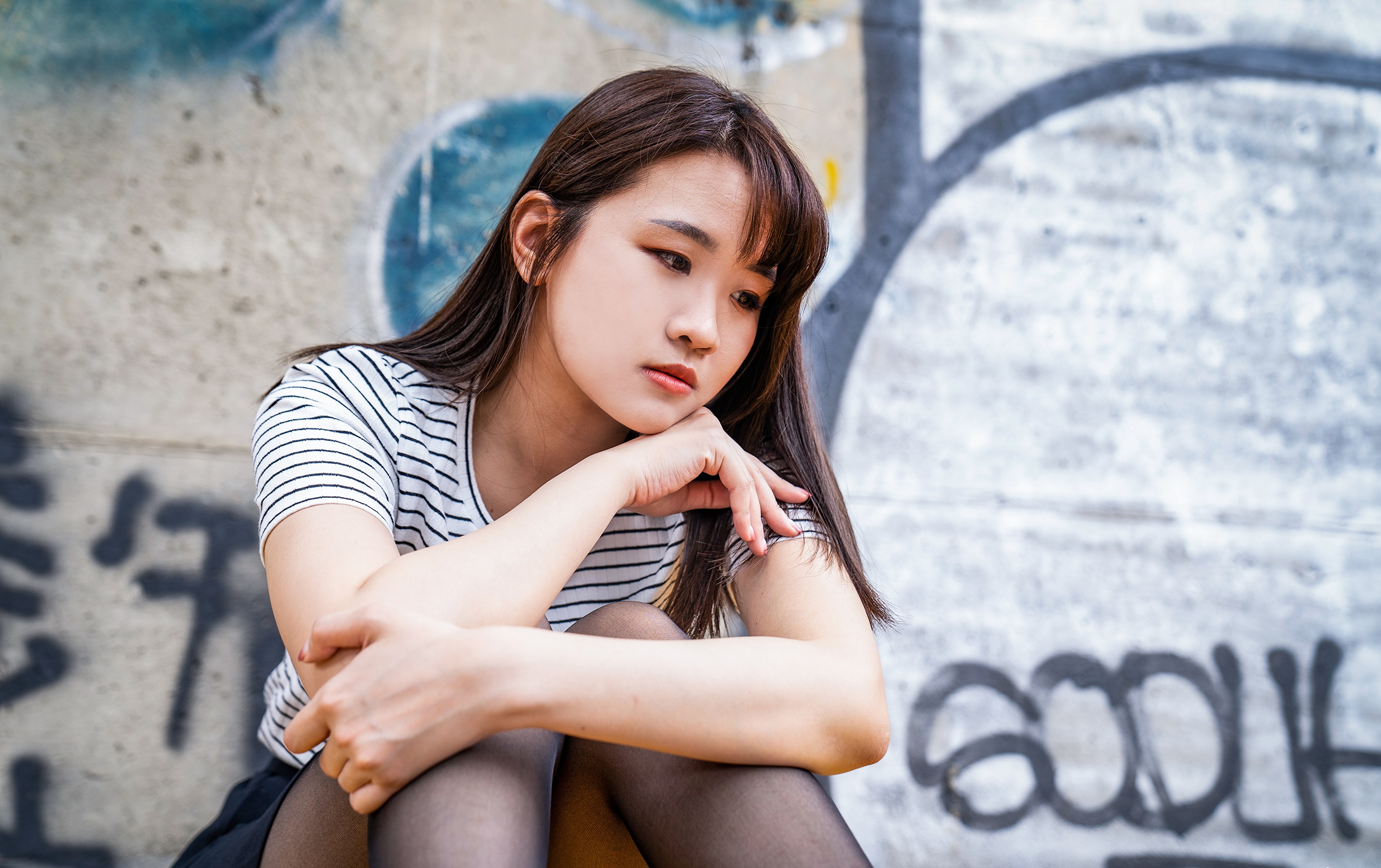 Asian Model Women Long Hair Dark Hair Wall Graffiti Sitting Nylons Striped Shirt Depth Of Field Skir 3840x2413