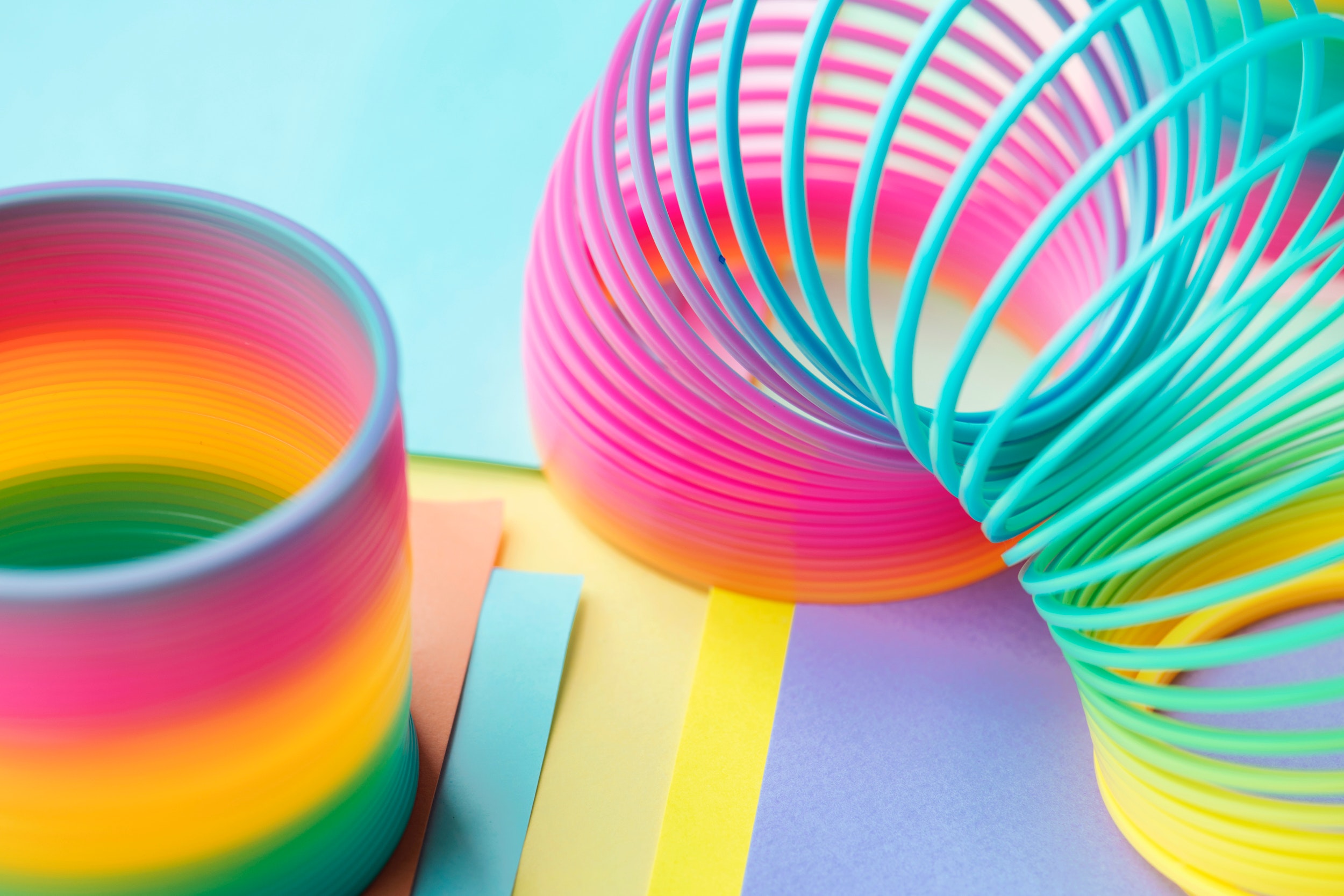 Slinky Colorful Pastel Rainbow Toy Pink Yellow Blue 2500x1667