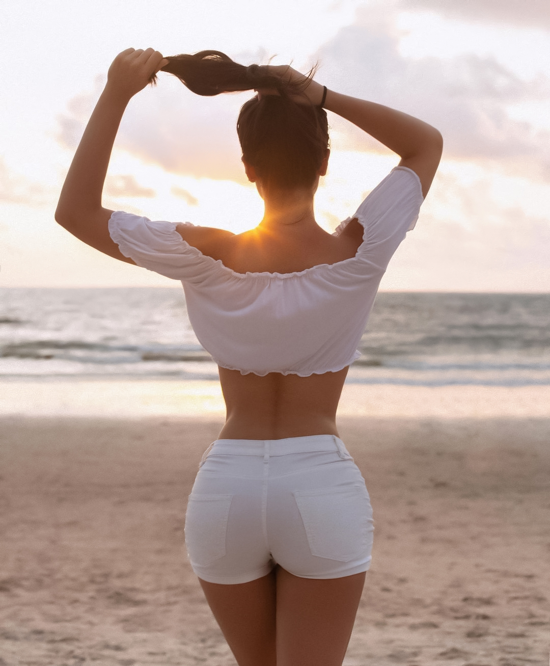 Women Irina Dreyt Brunette Holding Hair Sunlight Sun Rays White Clothing Shorts Shore Beach Horizon 1080x1307