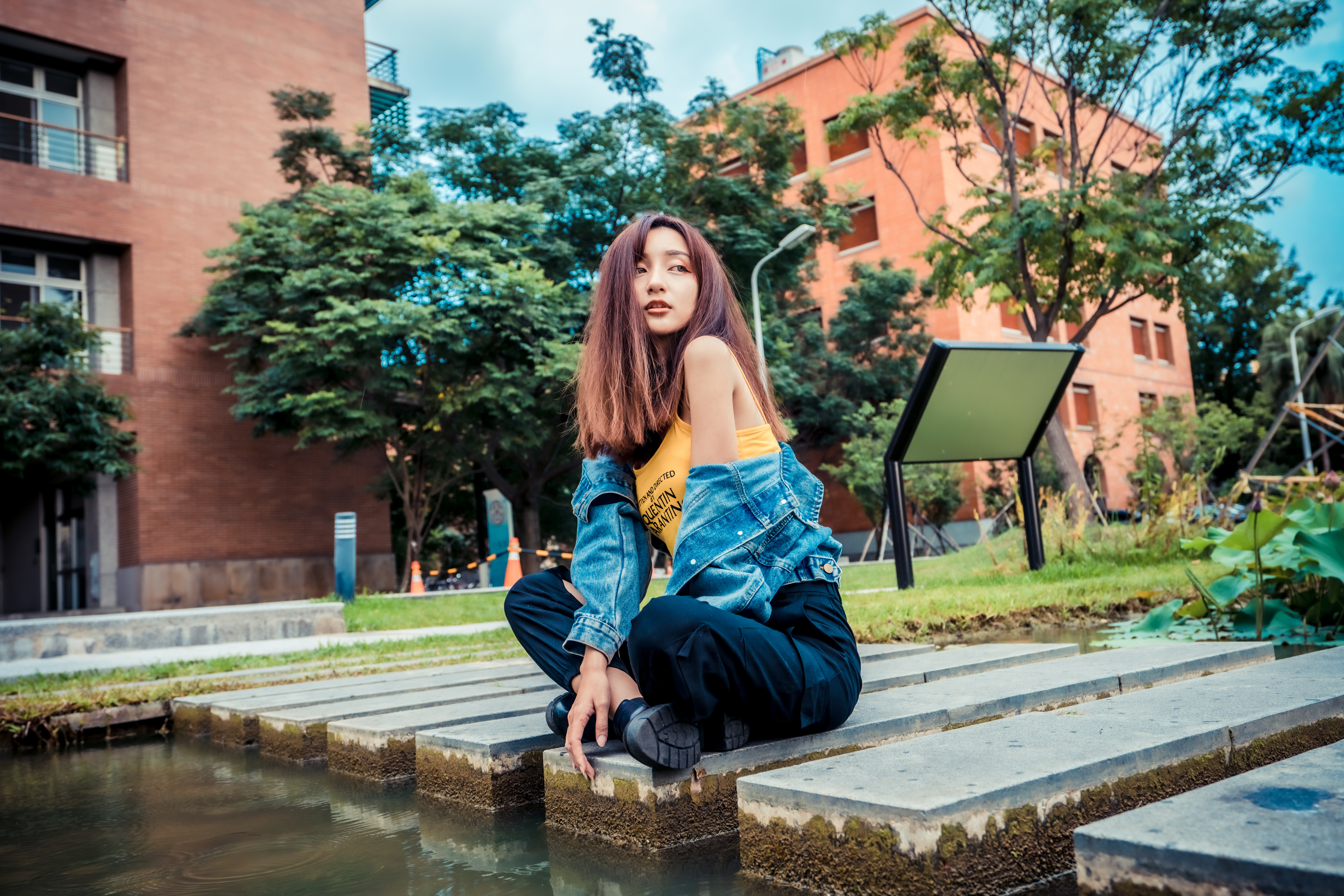 Asian Model Women Long Hair Dark Hair Depth Of Field Trees Pond Grass Building Sign Sitting Legs Cro 3840x2561