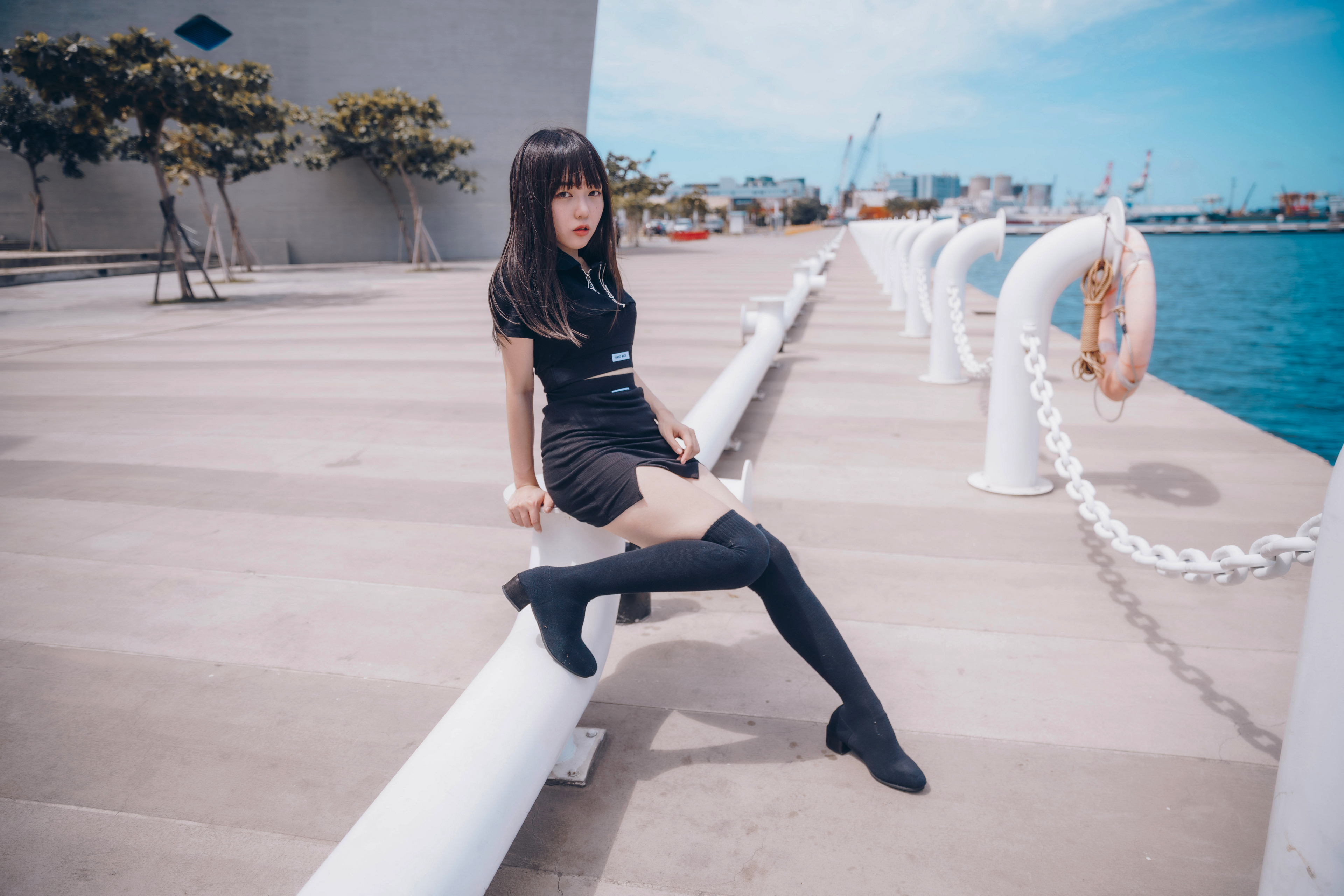 Asian Model Women Long Hair Dark Hair Knee High Boots Sitting Trees Pier Sea Depth Of Field 3840x2561