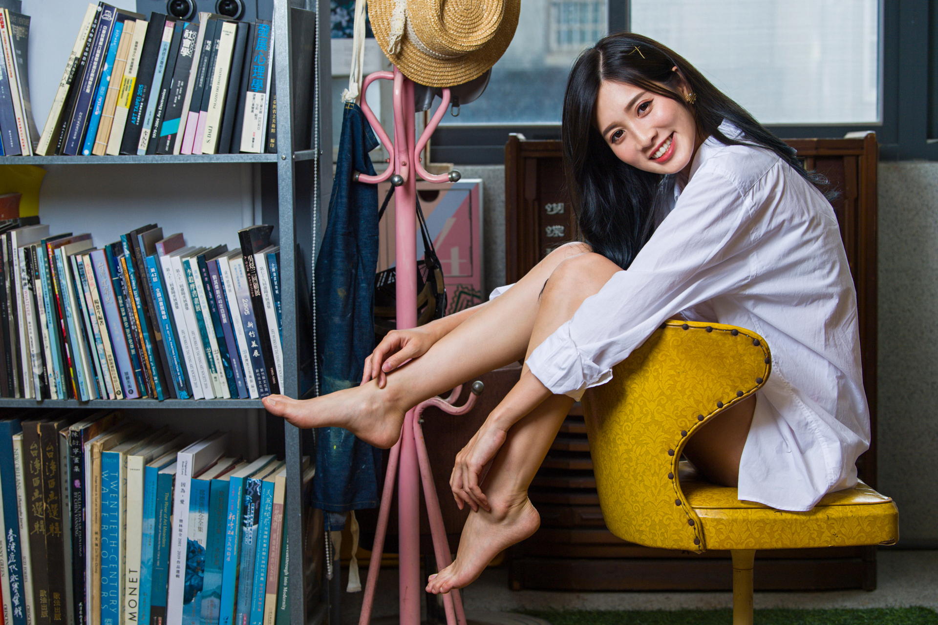 Asian Model Women Long Hair Dark Hair Barefoot White Shirt Chair Sitting Shelves Books Hat Depth Of  1920x1280
