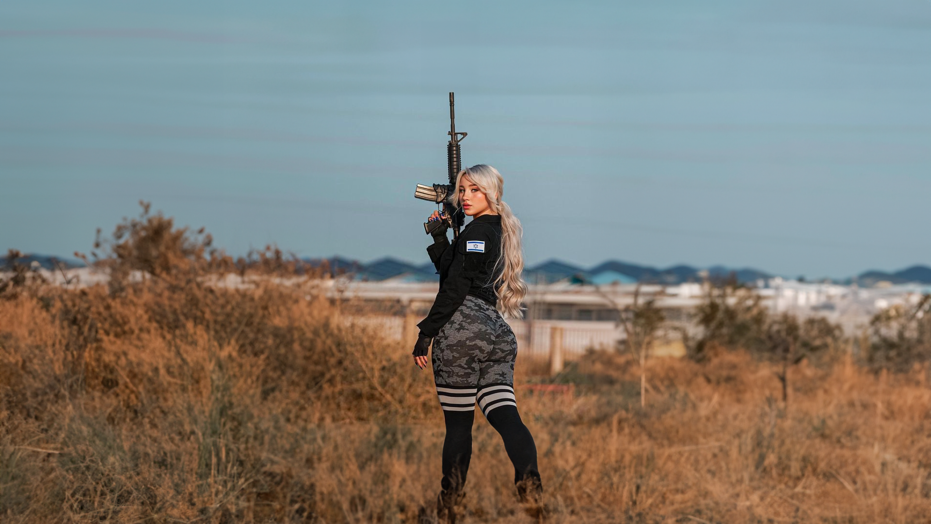 Women Ground Weapon Israel Looking At Viewer Gun Long Hair Blonde Blurred Blurry Background 1920x1080