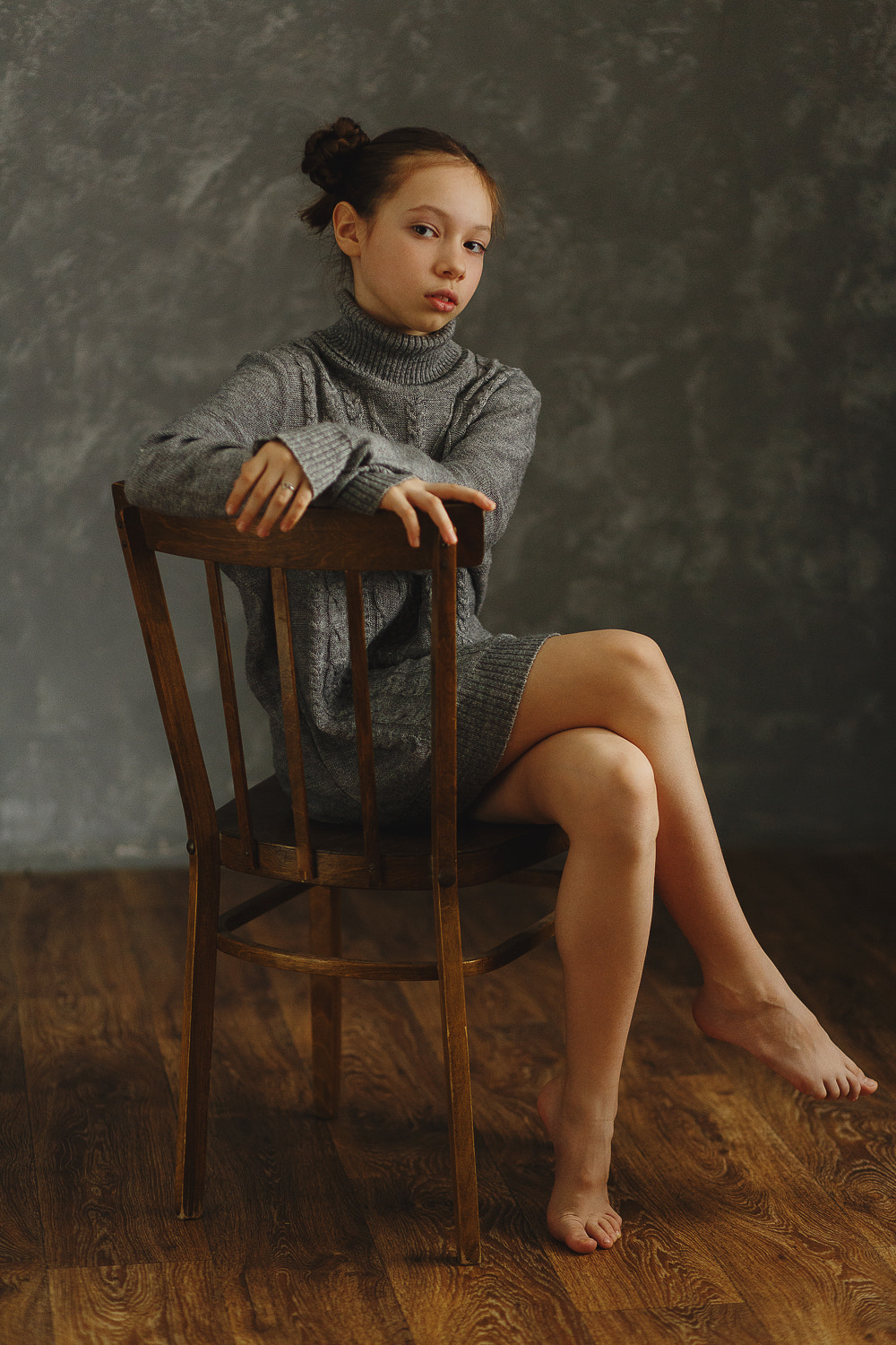 Anton Zhilin Hairbun Sweater Barefoot Chair Women Portrait Display Sitting Legs Crossed Floor Indoor 1000x1500