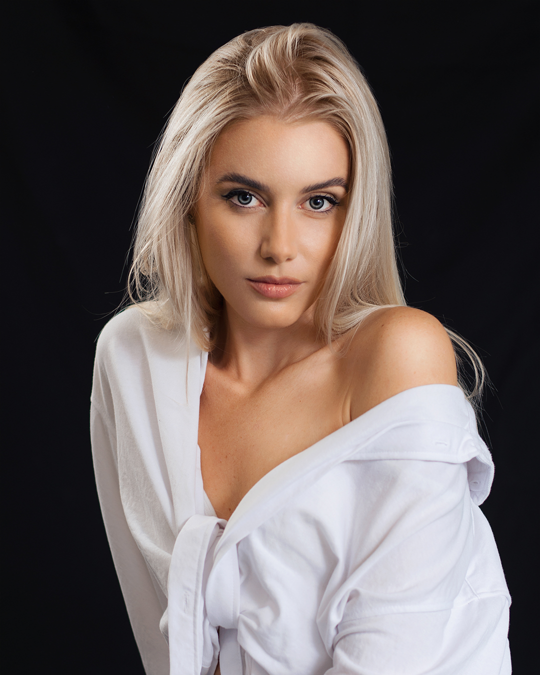 Jozef Kiss Women Blonde Blue Eyes Eyeliner Bare Shoulders White Clothing Simple Background Portrait 1080x1350
