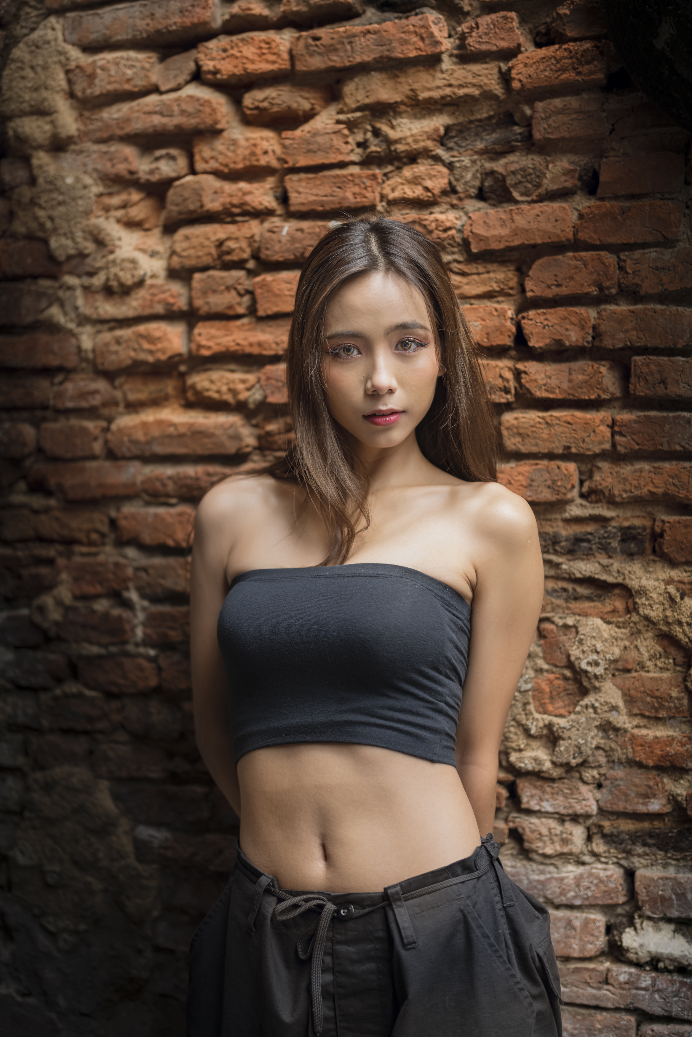 Chou Hsuan Yung Women Asian Brunette Looking At Viewer Arms Behind Back Bricks Shadow Wall 2335x3500