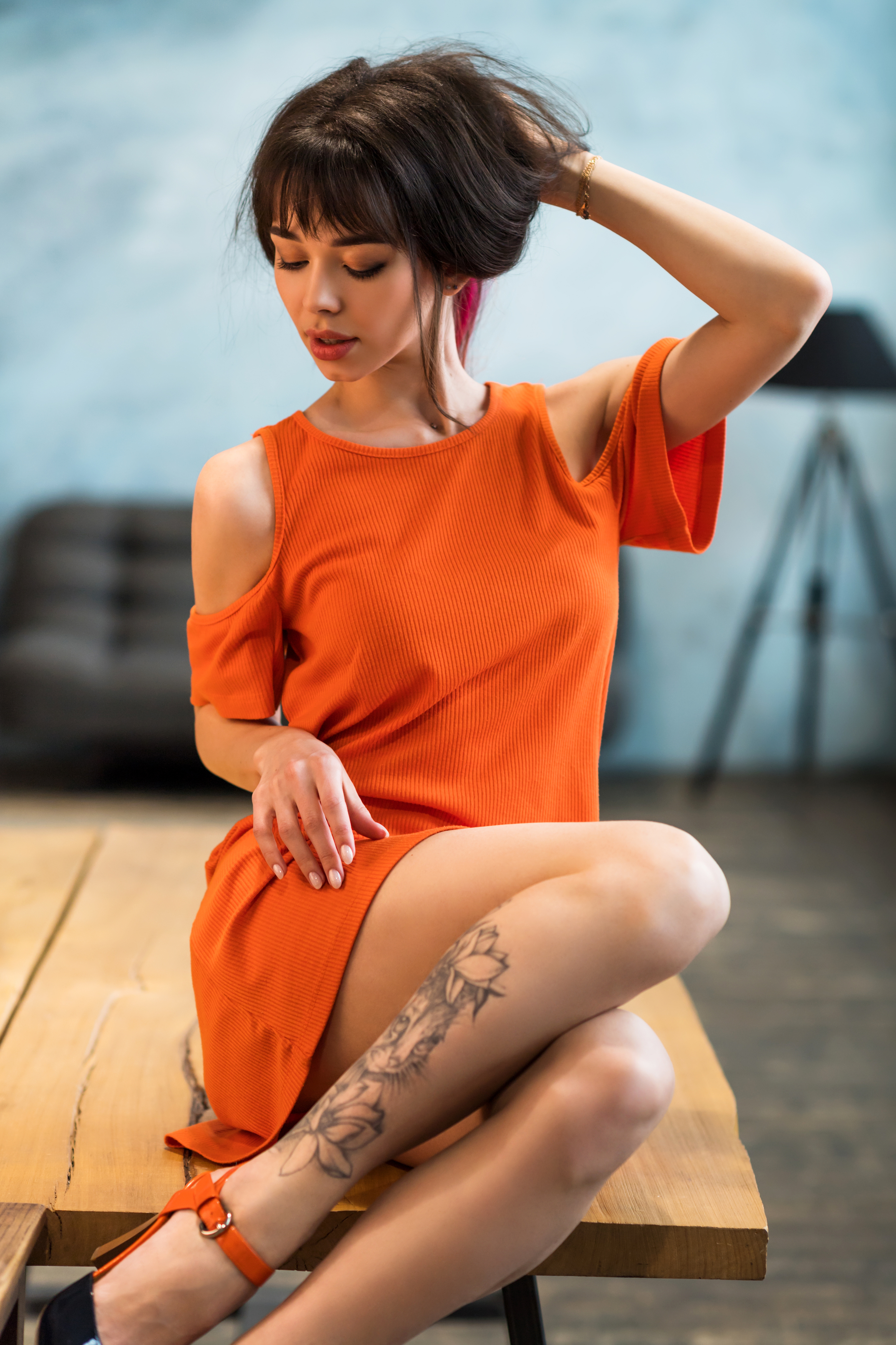 Sergey Zemnuhov Women Brunette Hands In Hair Bangs Orange Clothing Dress Tattoo Legs Table 2333x3500