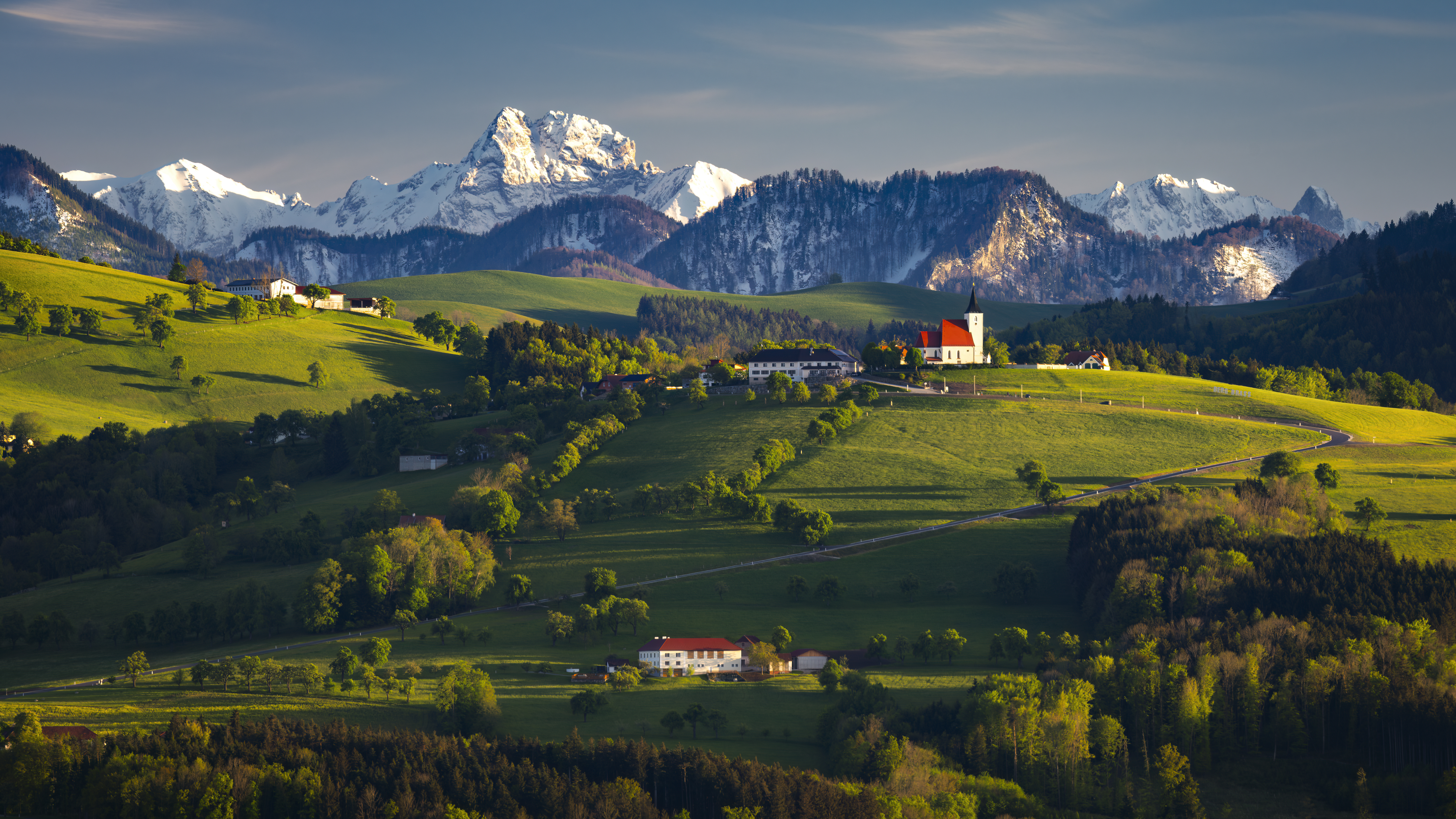 Nature Landscape Clouds Sky Trees Mountains Snowy Peak Snow Grass Field House Building Village Sunli 5000x2813