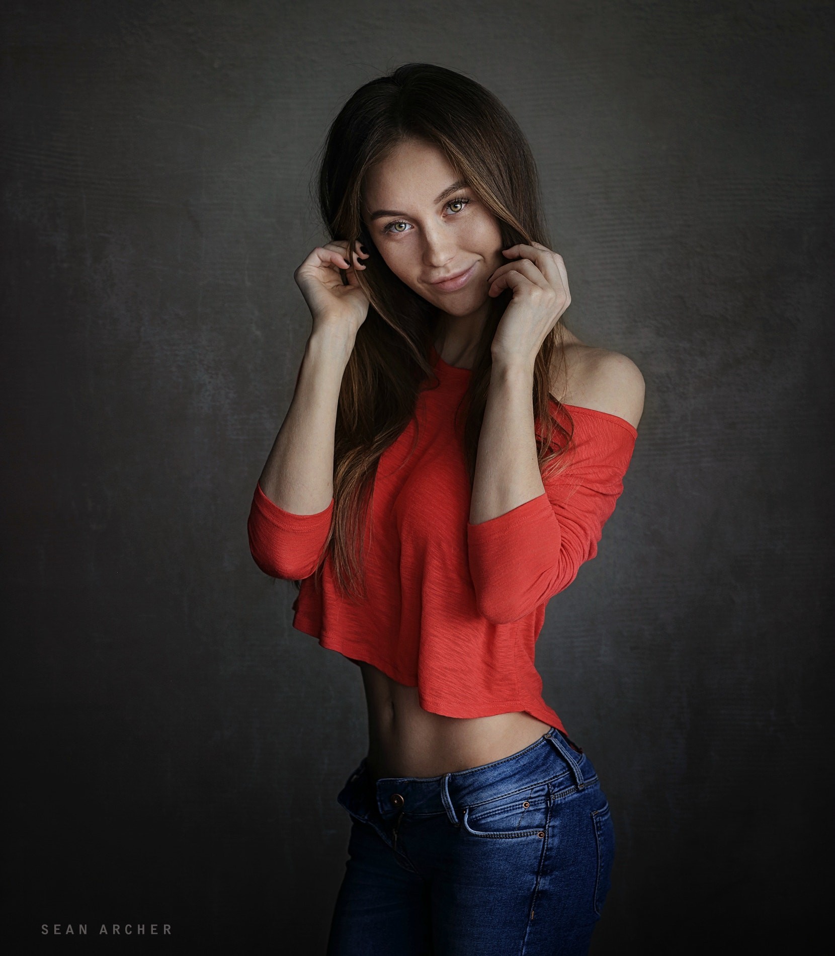 Model 500px Women Simple Background Olga Katysheva Holding Hair Red Tops Smiling Jeans Touching