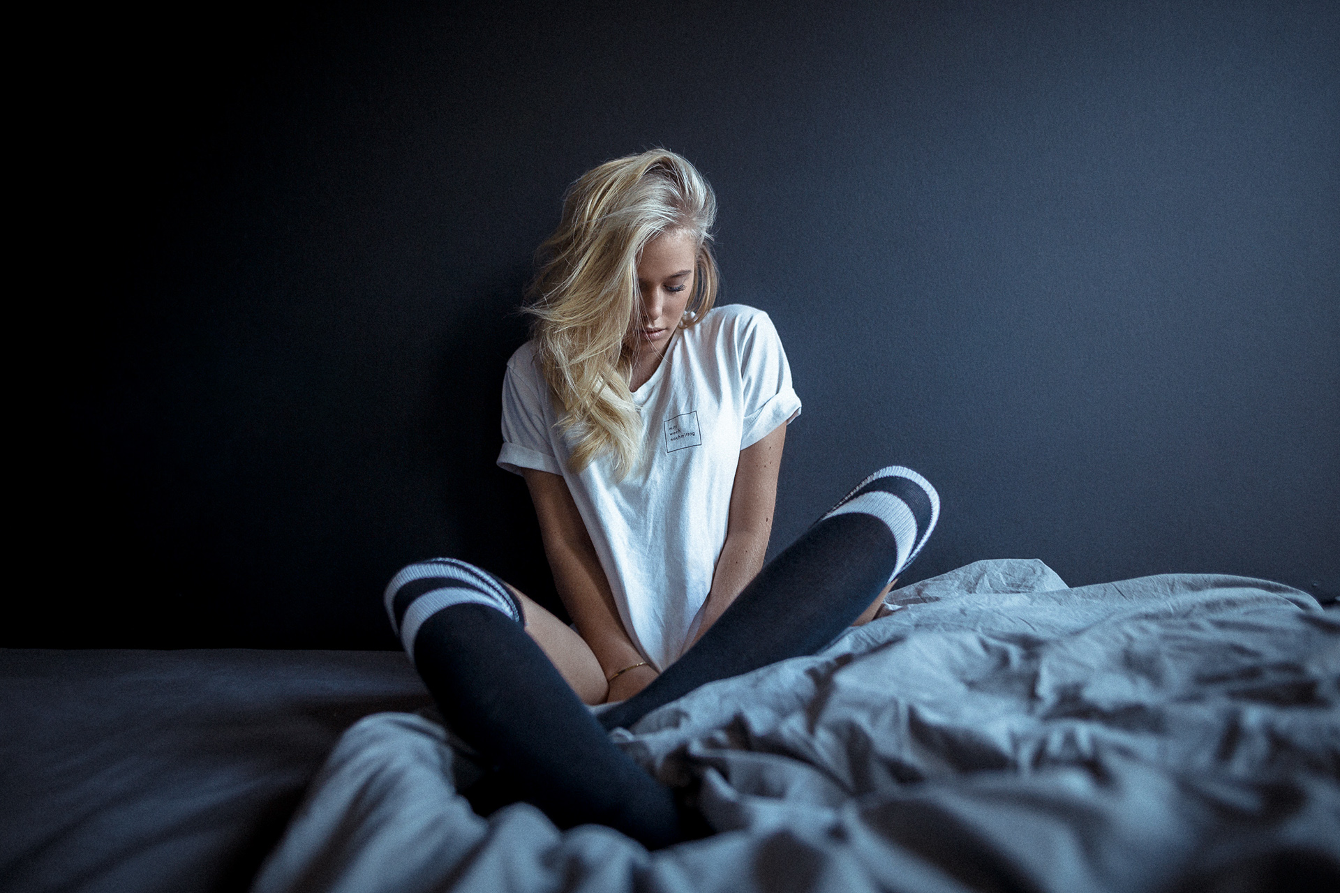 Women Model Blonde T Shirt Sitting In Bed Knee Highs Dark Background OTK Socks 1920x1280