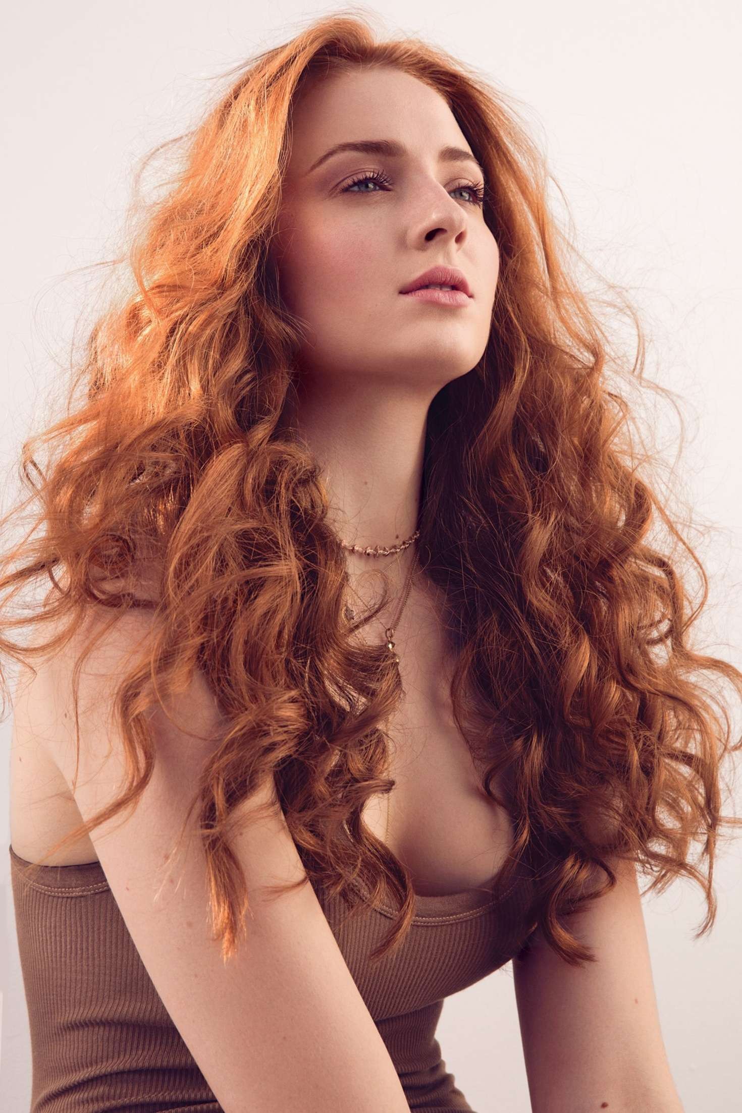 Women Actress Sophie Turner Redhead Long Hair Curly Hair Brown Tops Looking Into The Distance 1470x2206