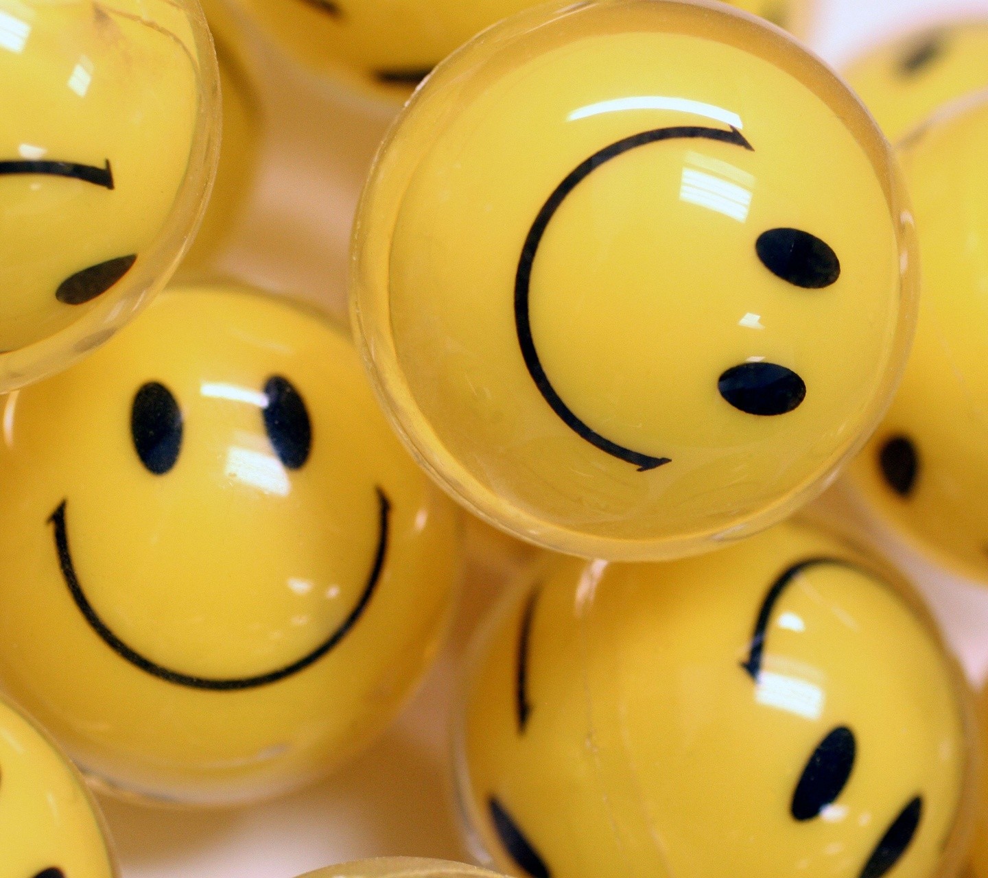 Premium AI Image  A yellow smiley ball surrounded by many small balls with  sad faces