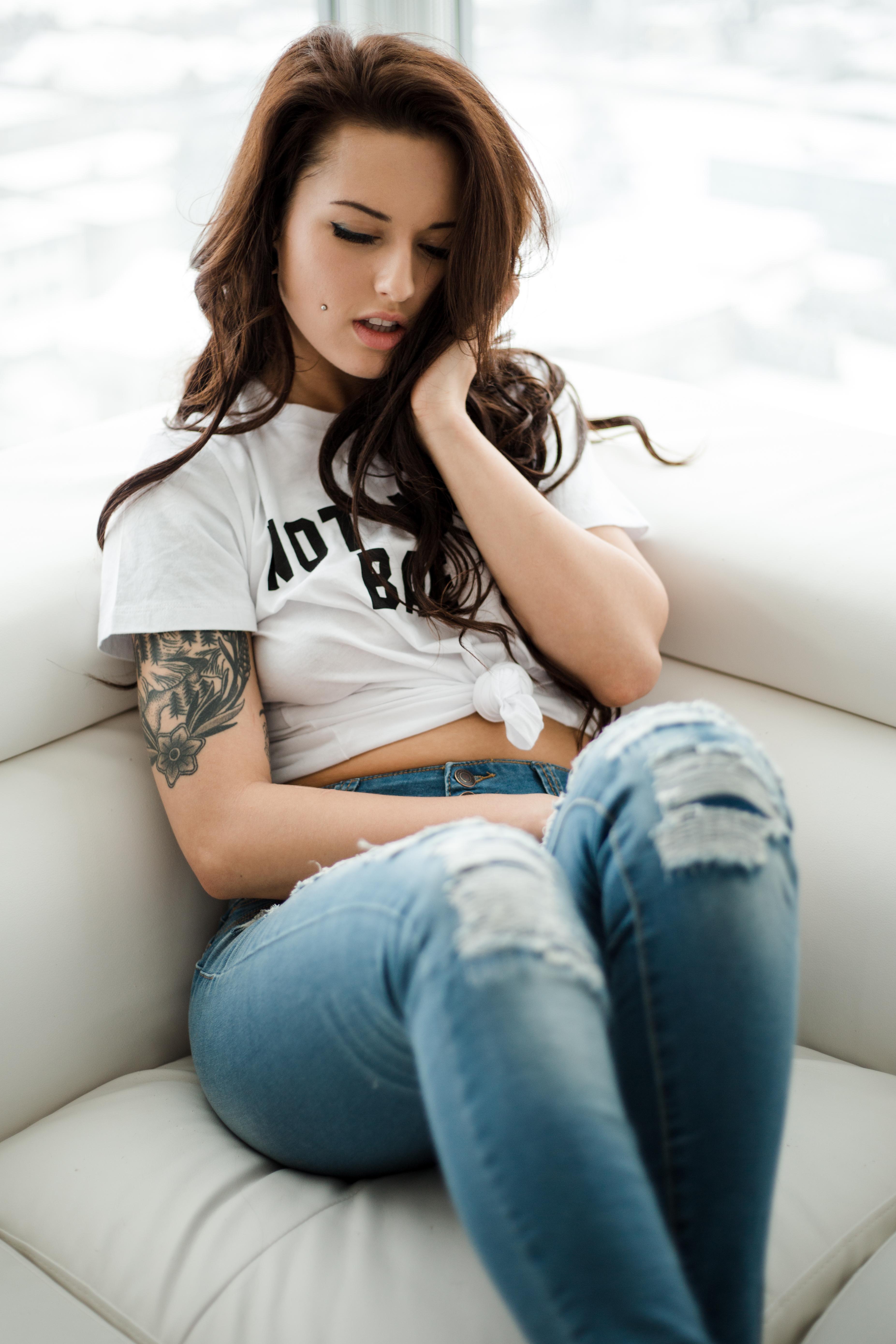 Model Women Couch Tattoo Inked Girls Torn Jeans T Shirt Women Indoors Sitting Brunette Pierced Cheek 3706x5559