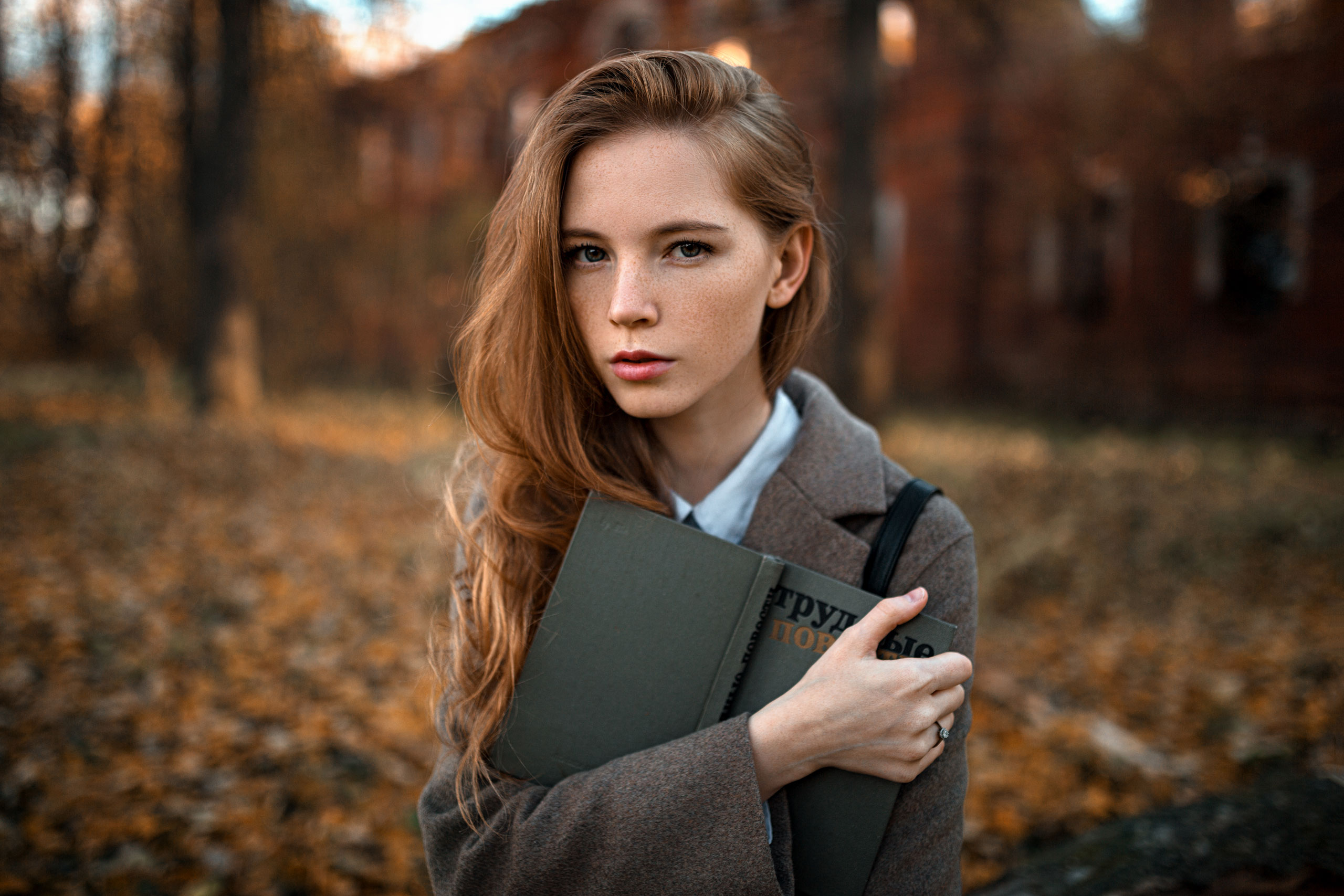 Women Model Redhead Long Hair Looking At Viewer Portrait Outdoors Freckles Coats Books Forest Trees  2560x1707