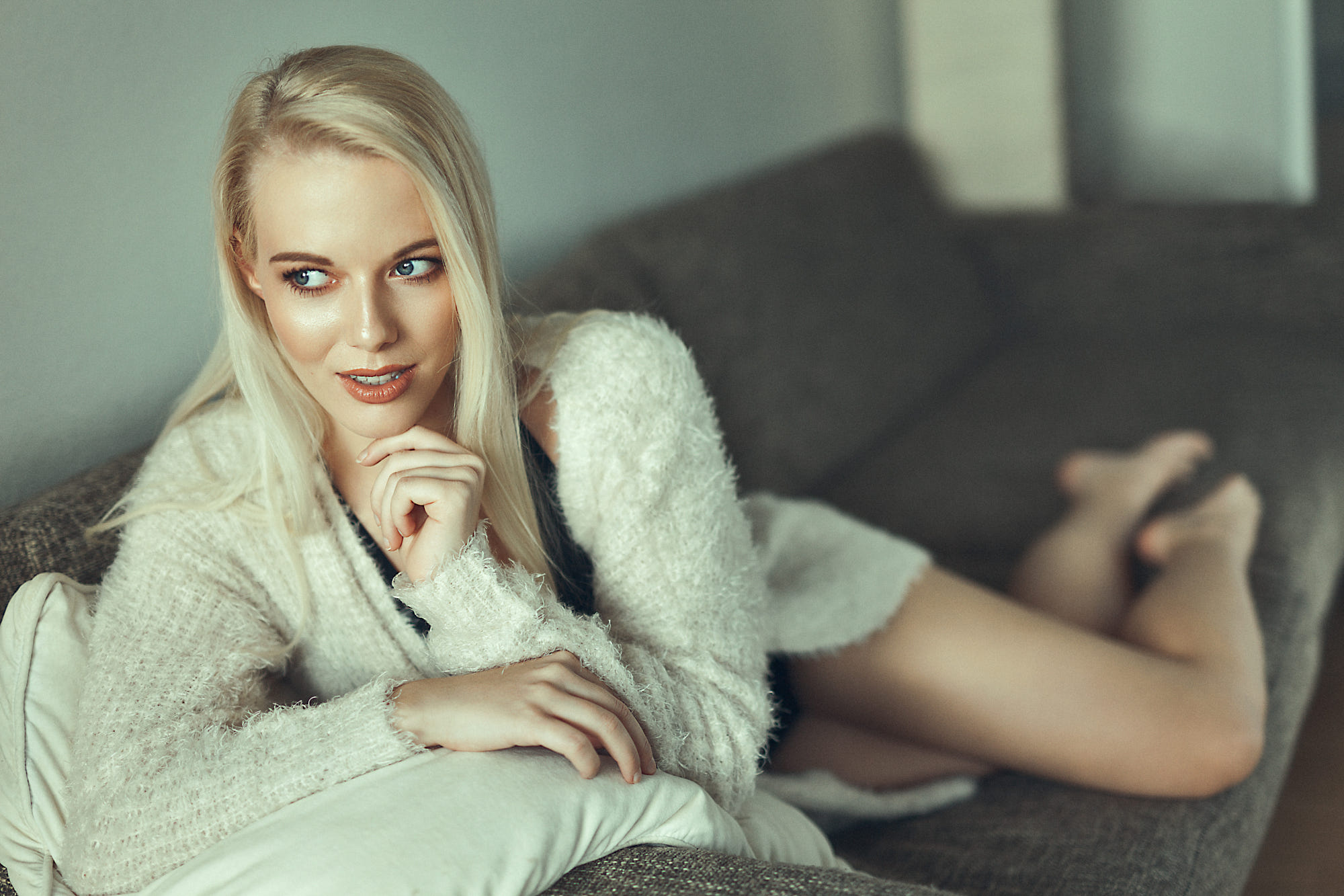 Women Model Blonde Blue Eyes Hand On Face Black Top Cardigan Looking Into The Distance Legs Sitting  2000x1333