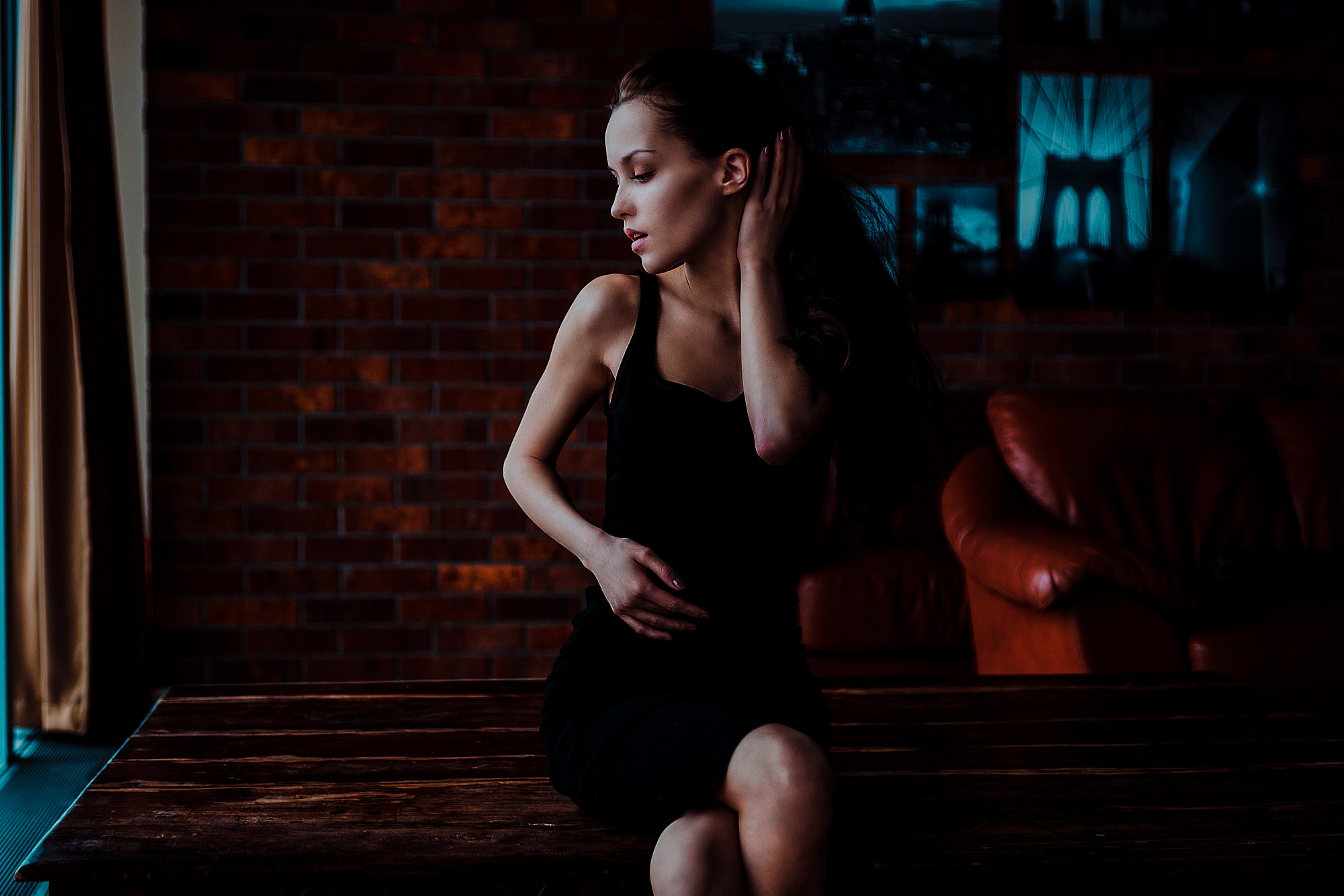 Women Table Fenix Raya Black Dress Sitting Wall Bricks Looking Away Daria Klepikova Dark 2000x1334