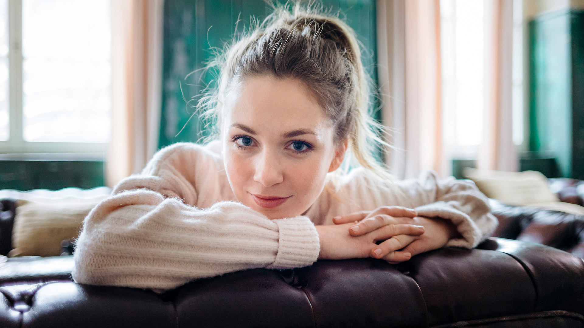 Women Portrait Model Blonde Blue Eyes Looking At Viewer Smile Couch Depth Of Field White Sweater Swe 1920x1080