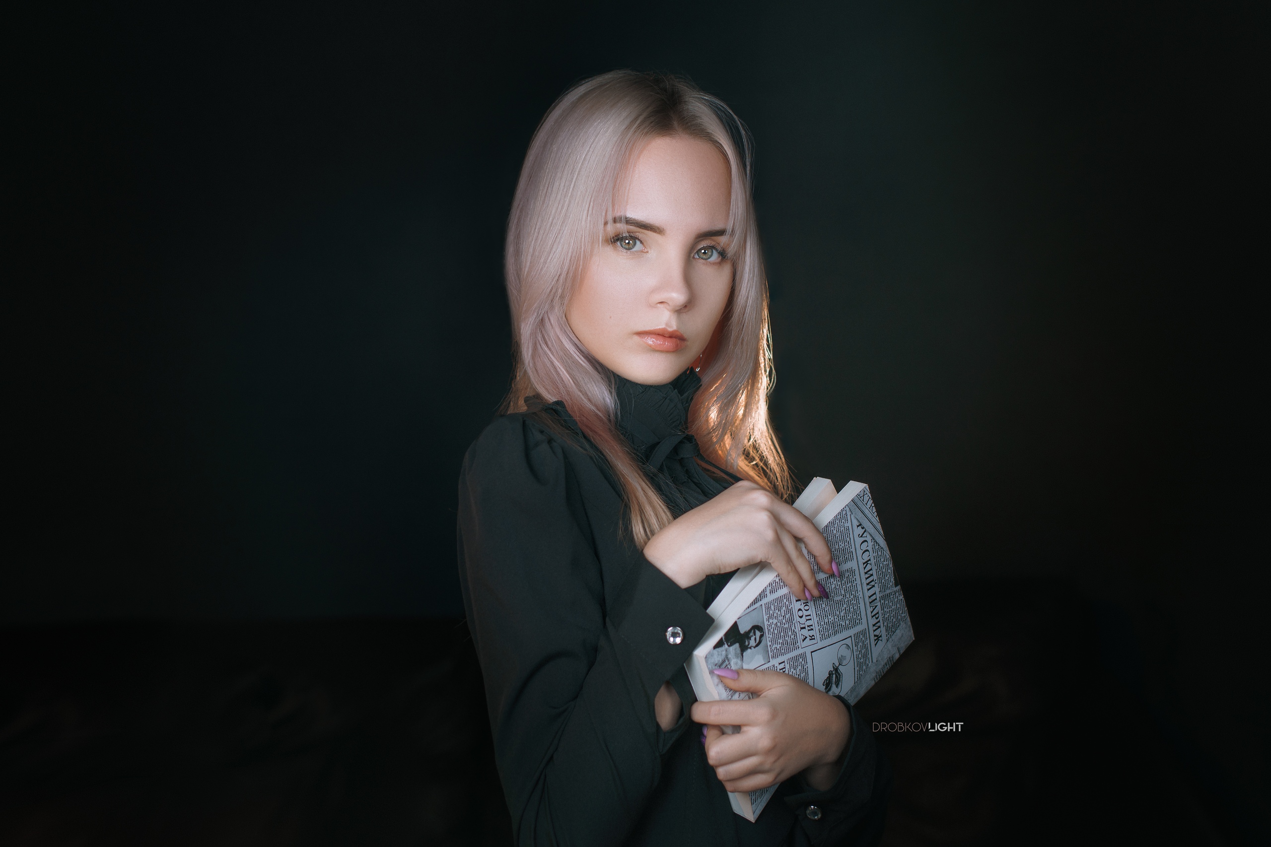 Anastasia Makarenko Women Model Blonde Looking At Viewer Portrait Indoors Dark Books Black Clothing  2560x1707