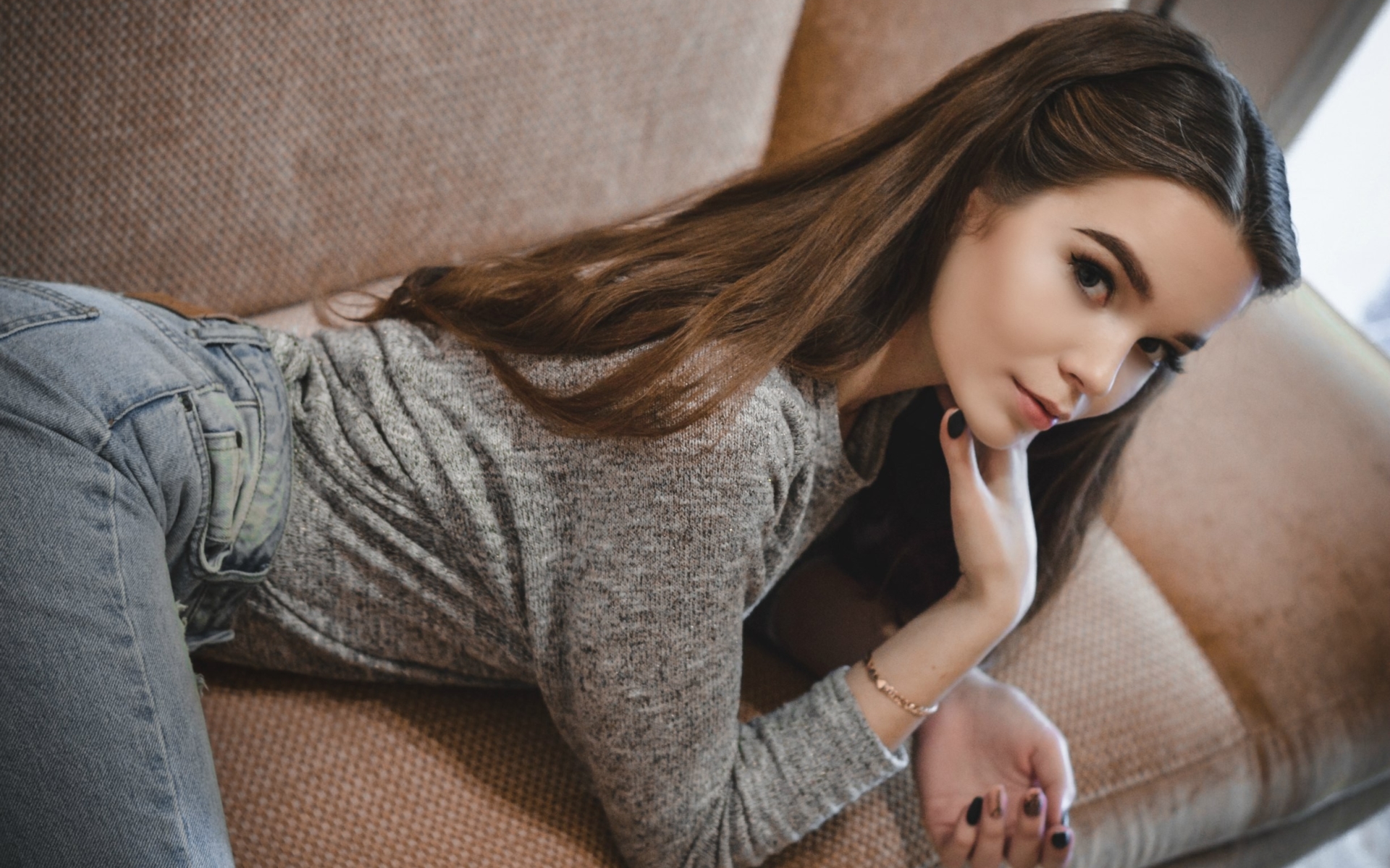 Women Brunette Brown Eyes Grey Shirt Jeans Denim Couch Looking At Viewer Grey Sweater Touching Face 1920x1200