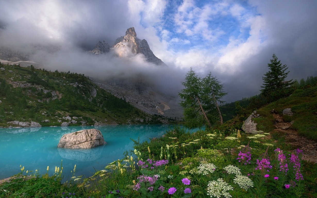 Dolomites Mountains Italy Spring Mist Lake Wildflowers Clouds Turquoise Water Trees Grass Sunset Sky 1230x768