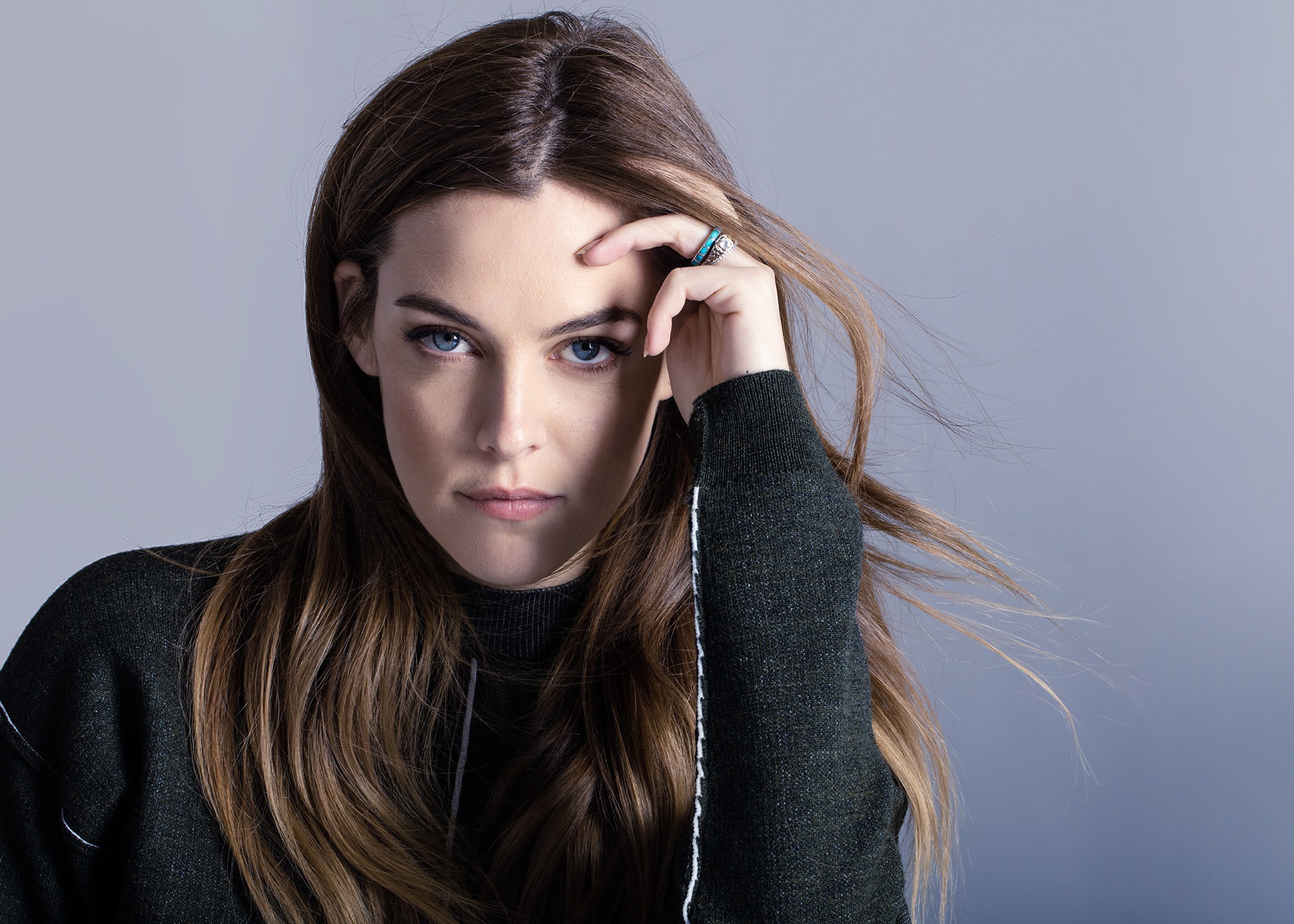 Riley Keough Actress Blue Eyes Brunette Long Hair Looking At Viewer Simple Background Sweater Black  1946x1390