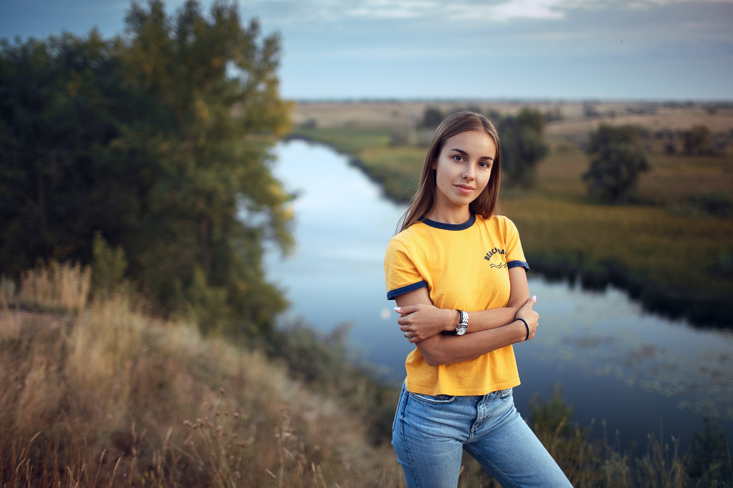 Women Yellow T Shirt River Nature Jeans Watch Arms Crossed Sky Women Outdoors Smiling 2560x1706