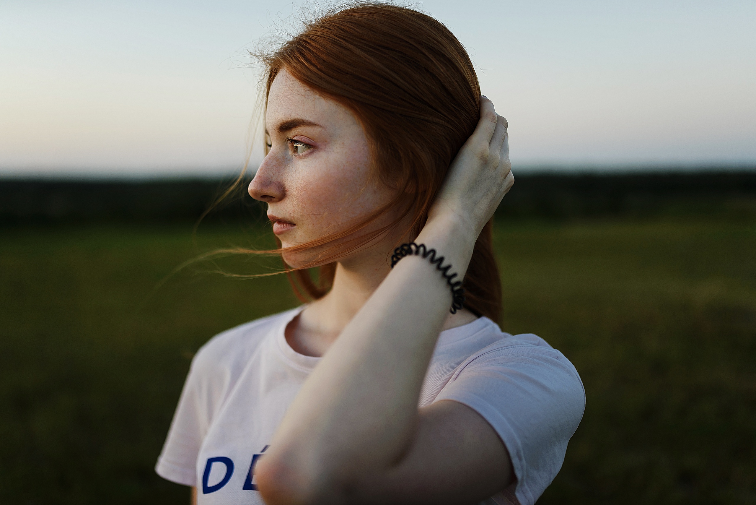 Women Model Portrait Outdoors Redhead T Shirt Depth Of Field Hand On Head Looking Into The Distance  2560x1709