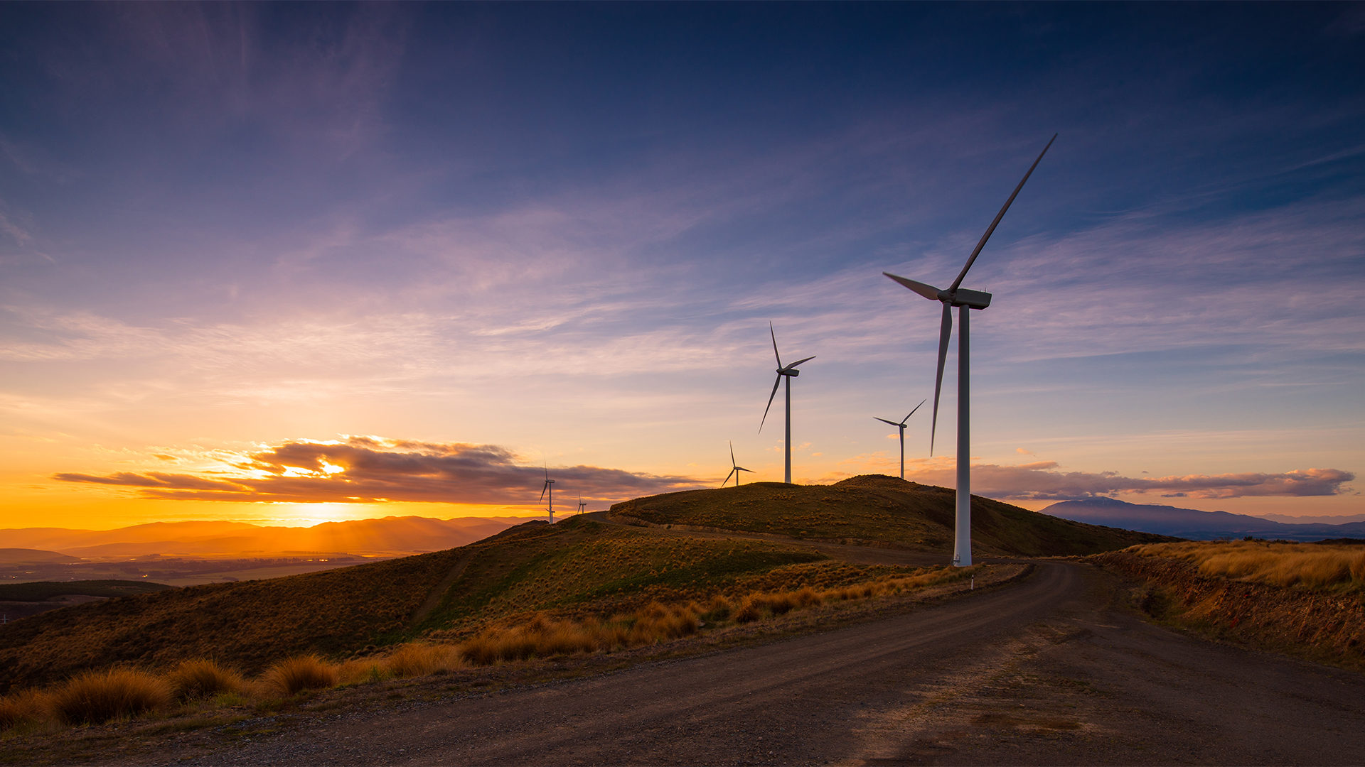 Nature Landscape Sunset Road Plants Windmill Sky Clouds Mountains Wind Farm New Zealand 1920x1080