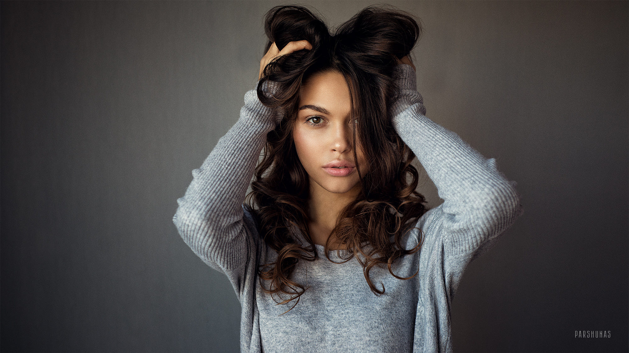 Women Brunette Hands In Hair Portrait Simple Background Face Dark Eyes Long Hair Sweater Anton Parsh 2000x1125