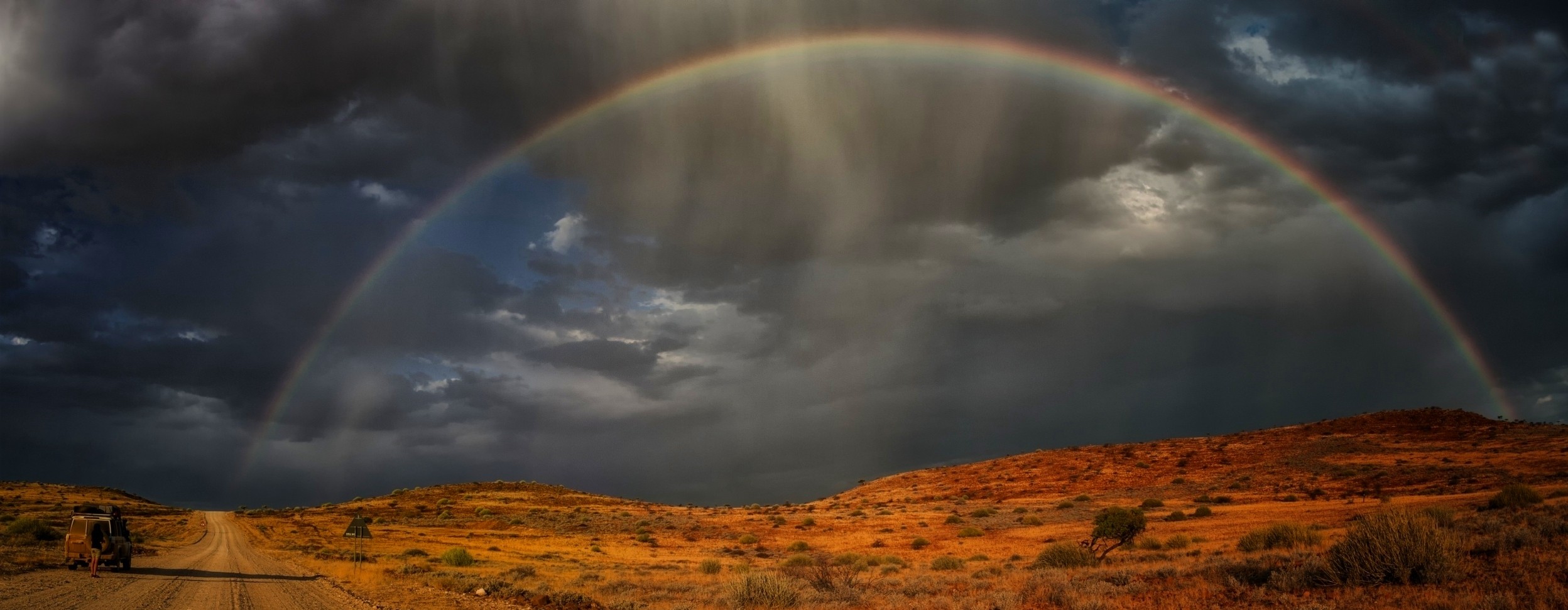 Landscape Nature Africa Namibia Rainbows Steppe Dirt Road Clouds Rain 4x4 Shrubs 2496x971