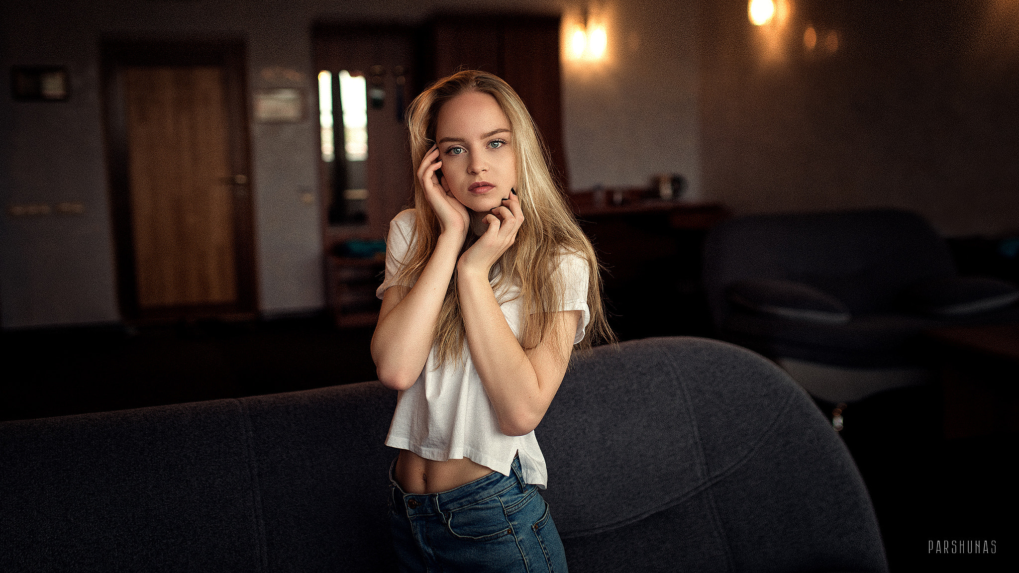 Women Anton Parshunas Blonde Blue Eyes Hand On Face White Shirt Jeans Denim Couch Looking At Viewer  2048x1152