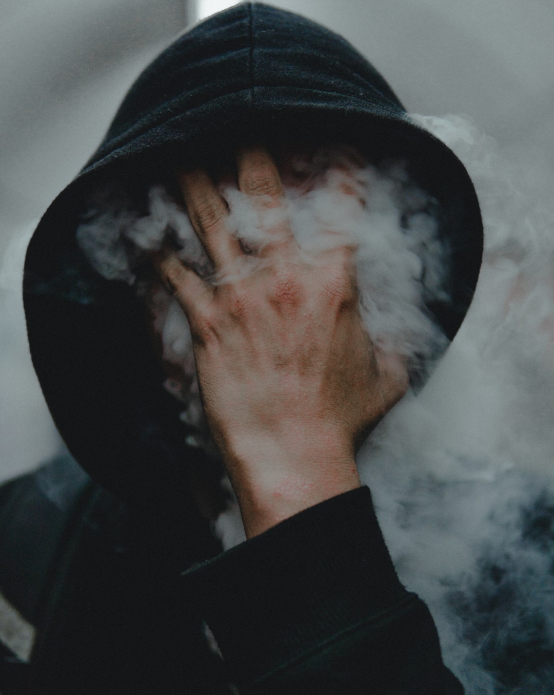 People Smoke Touching Face Covering Face Vertical Black Clothing Hoods Simple Background Hands Men F 1080x1353