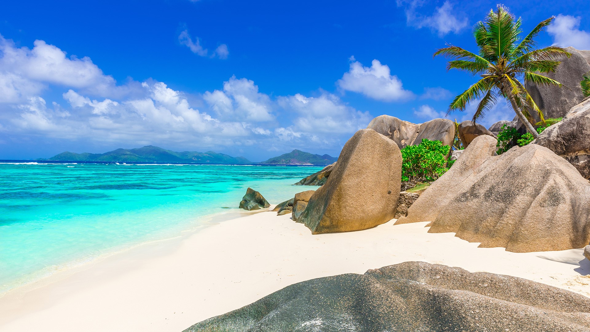 Nature Landscape Mountains Clouds Sky Beach Rocks Sand Water Clear Water Trees Seychelles 1920x1080