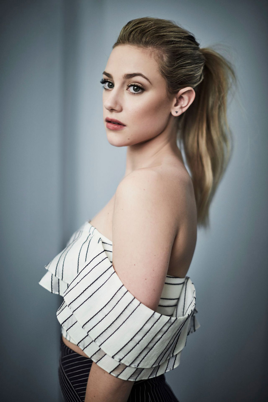 Lili Reinhart Women Actress Blonde Ponytail Simple Background Bare Shoulders Face Women Indoors 853x1280