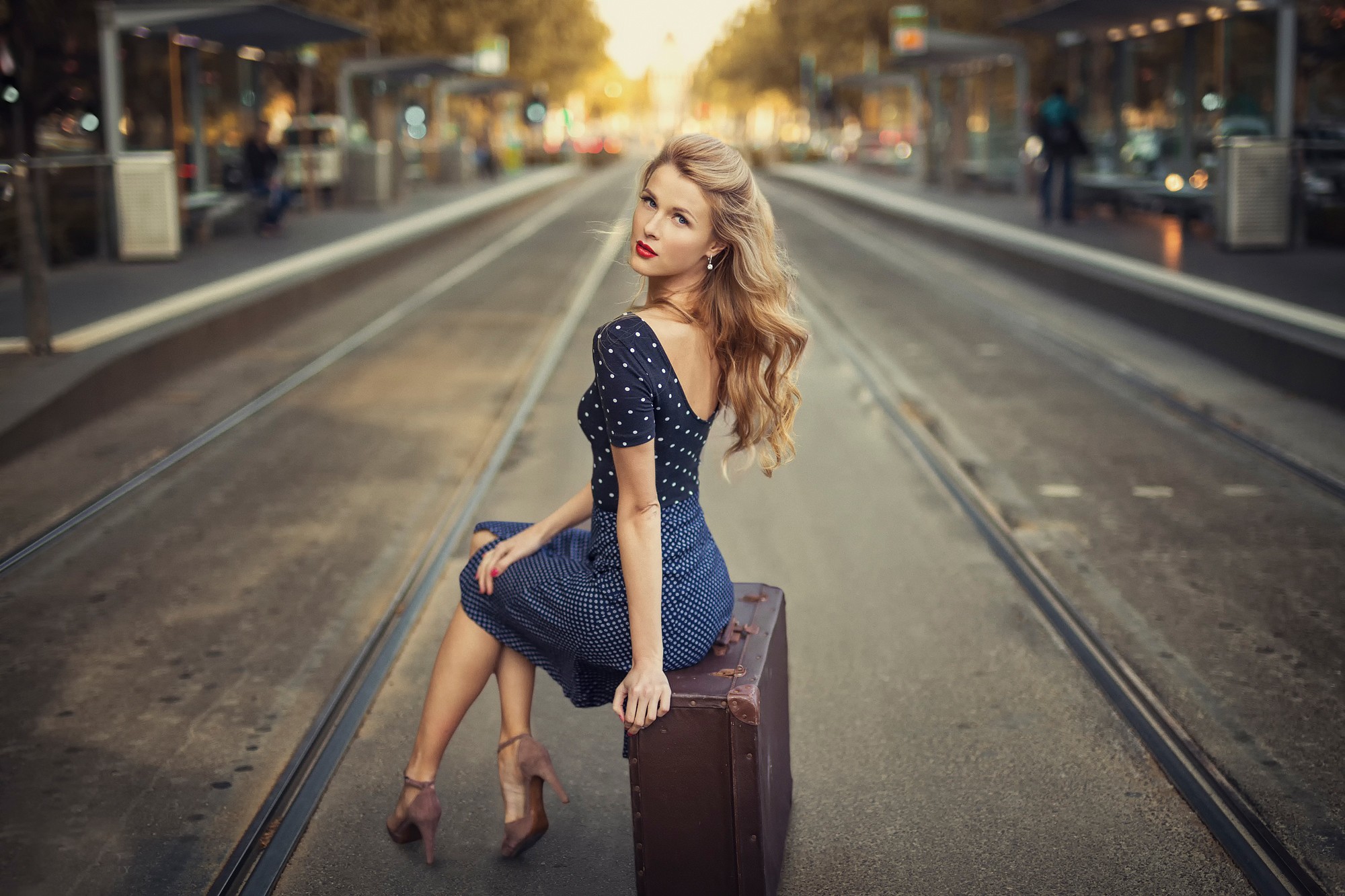 Women Model Blonde Long Hair Women Outdoors High Heels Blue Dress Polka Dots Sitting Suitcase Street 2000x1333