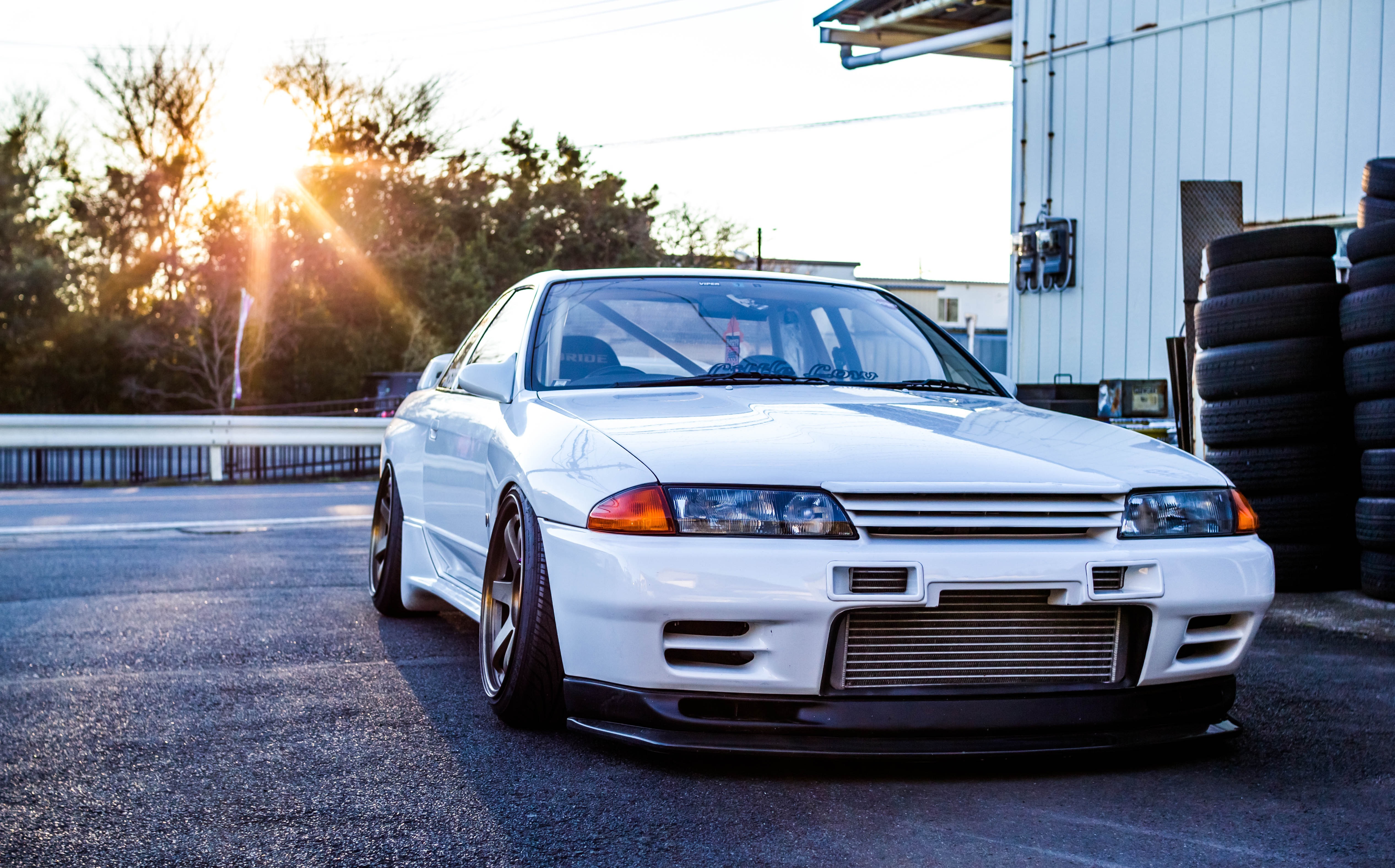 Nissan White Car Front Angle View Sun Rays Nissan Skyline R32 5065x3153