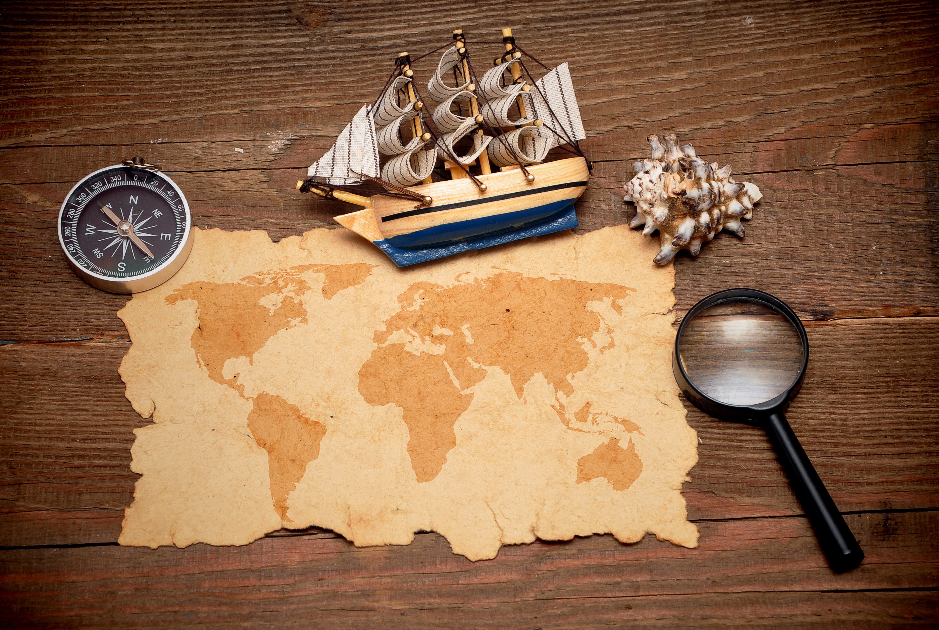 Wood Sailing Ship Magnifying Glasses Compass World Map Beige 3090x2076