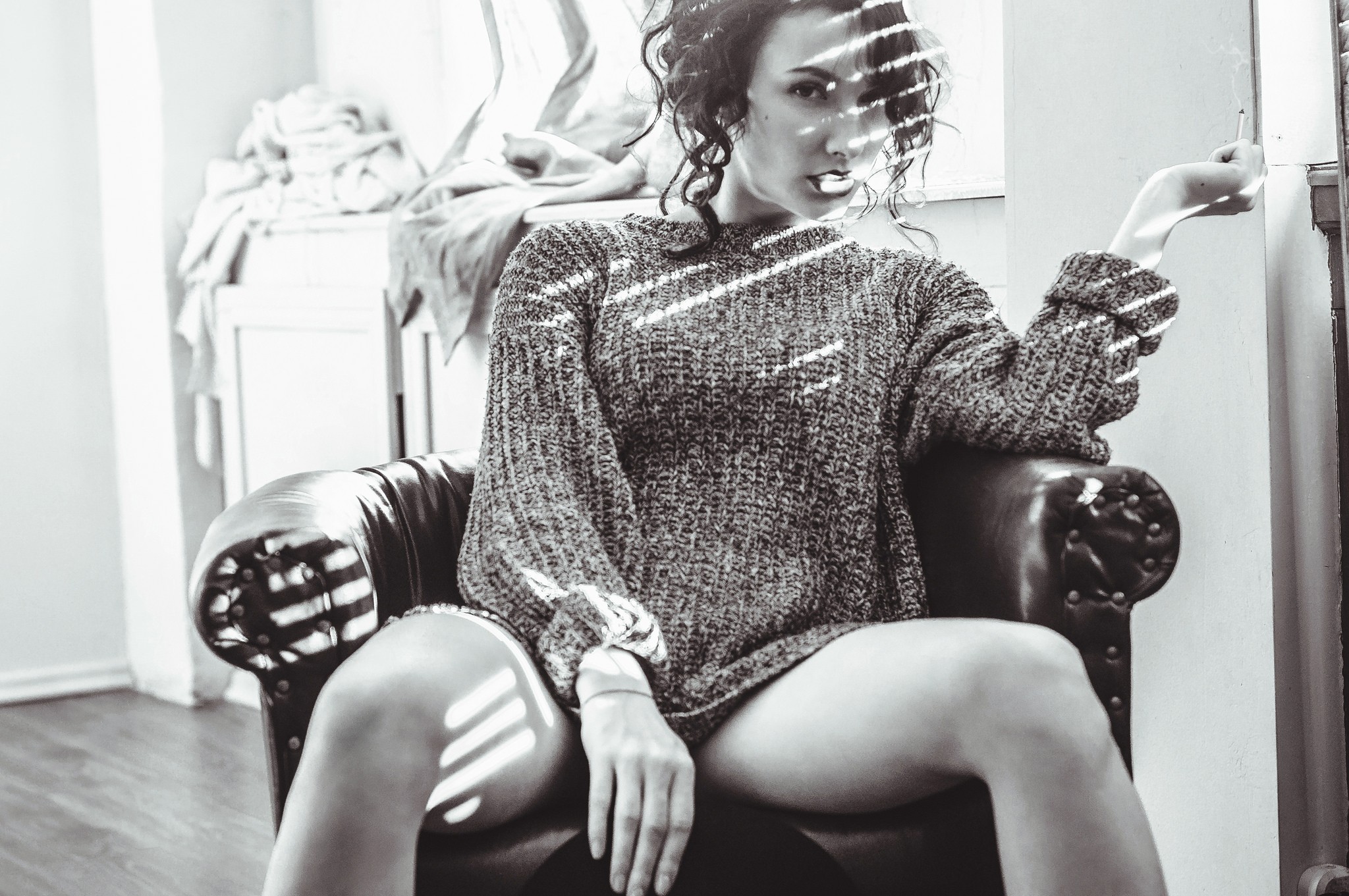 Women Monochrome Curly Hair Legs Wool Sweater Sitting Looking At Viewer Smoking Cigarettes 2048x1361